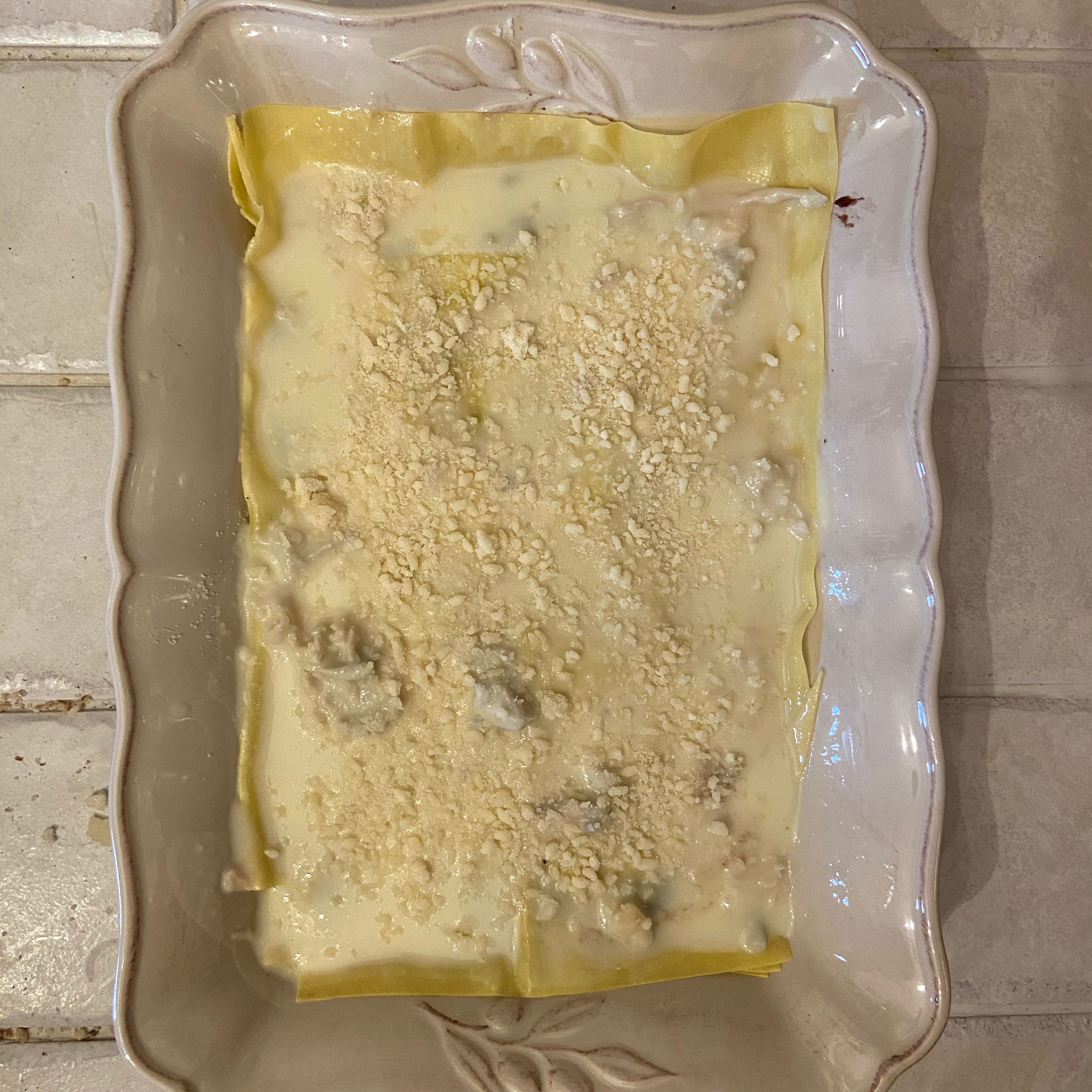 Only add the Gorgonzola sauce and Parmesan cheese as your final layer. Then bake in preheated oven at 200 degrees for around 25/30 minutes.