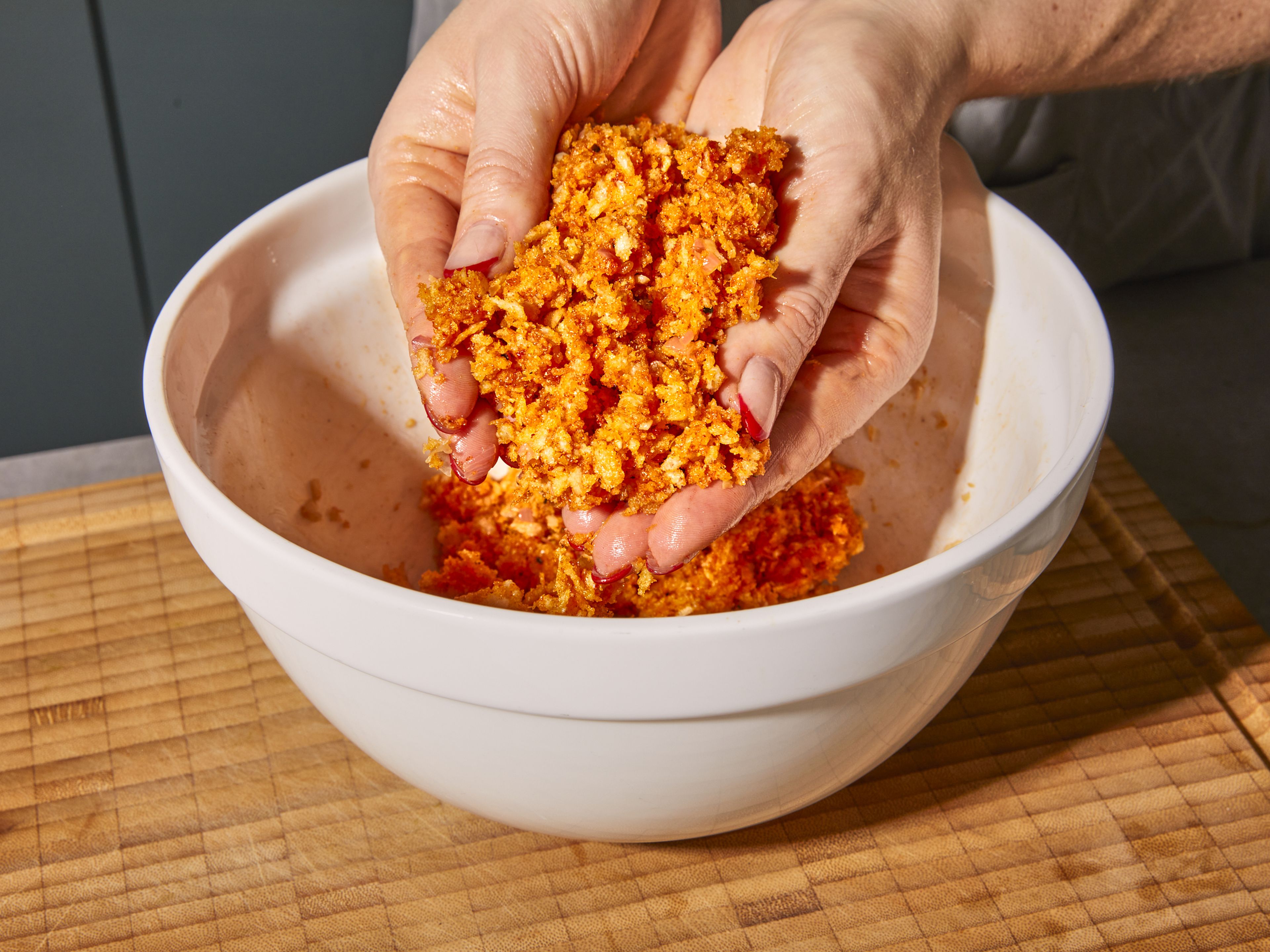 Turn off the heat and add butter and wine sauce to panko breadcrumbs, lemon zest, paprika, garlic powder, and beaten egg, combining well to evenly mix the breadcrumbs, egg and aromatics. Use your hands to gently scrunch the breadcrumbs to form a chunky but moist mixture.
