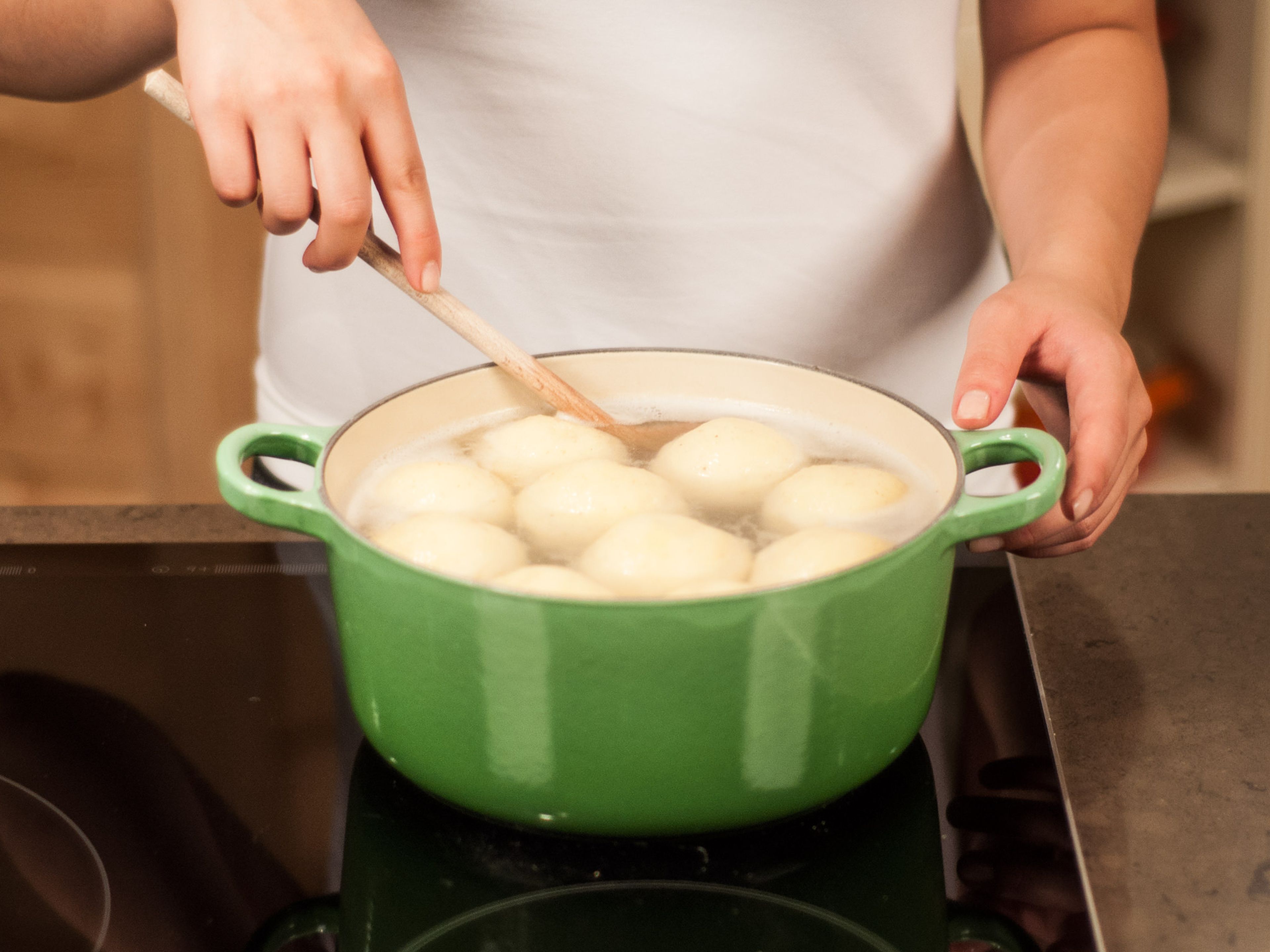 Bring a large pot of lightly salted water to a boil. Carefully drop dumplings into water and reduce heat. Allow to steep for approx. 20 – 30 min. until dumplings are floating. Then, carefully remove from water with a skimmer.