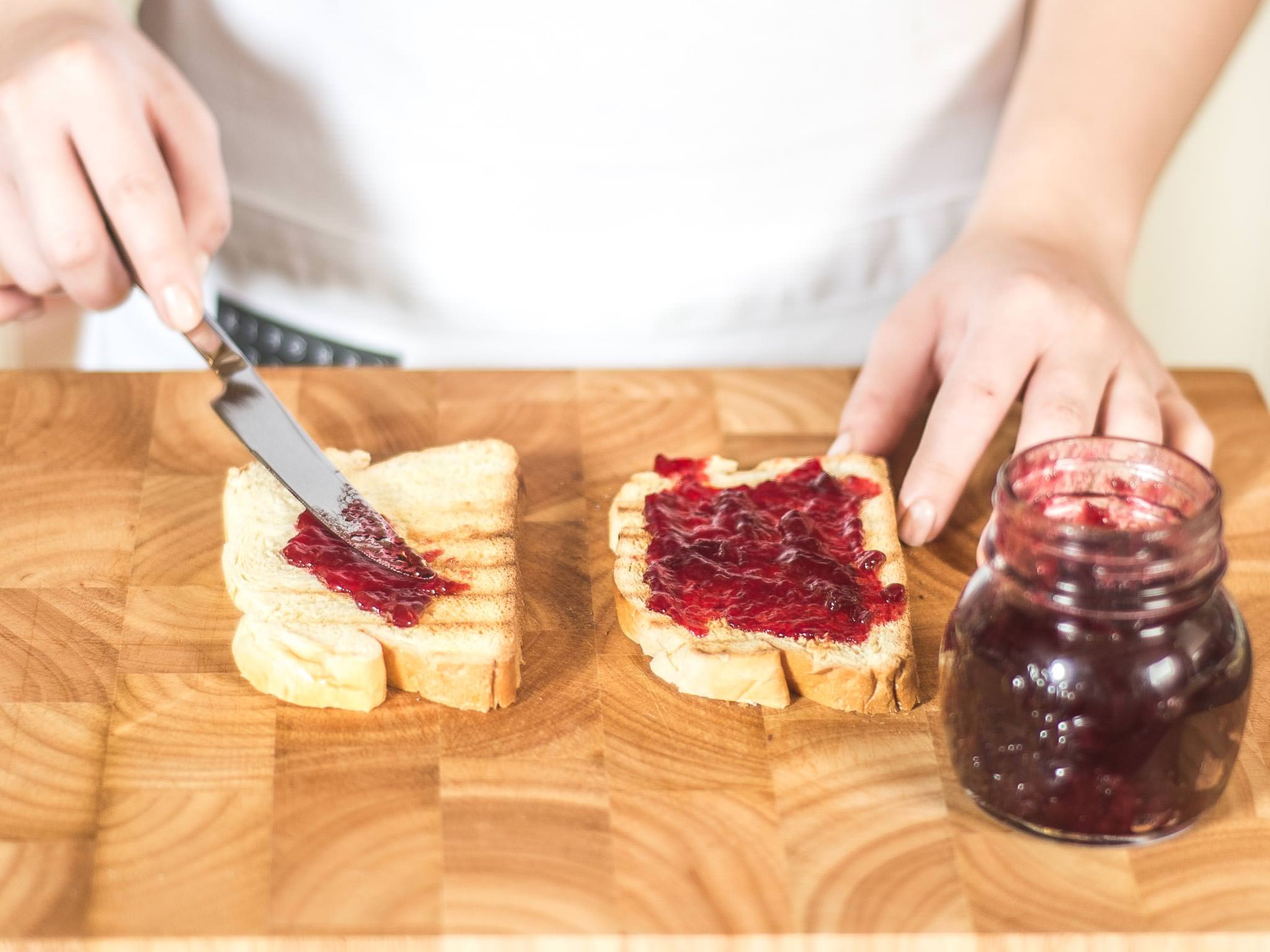 Spread each toasted slice of brioche with a teaspoon of lingonberry jam.