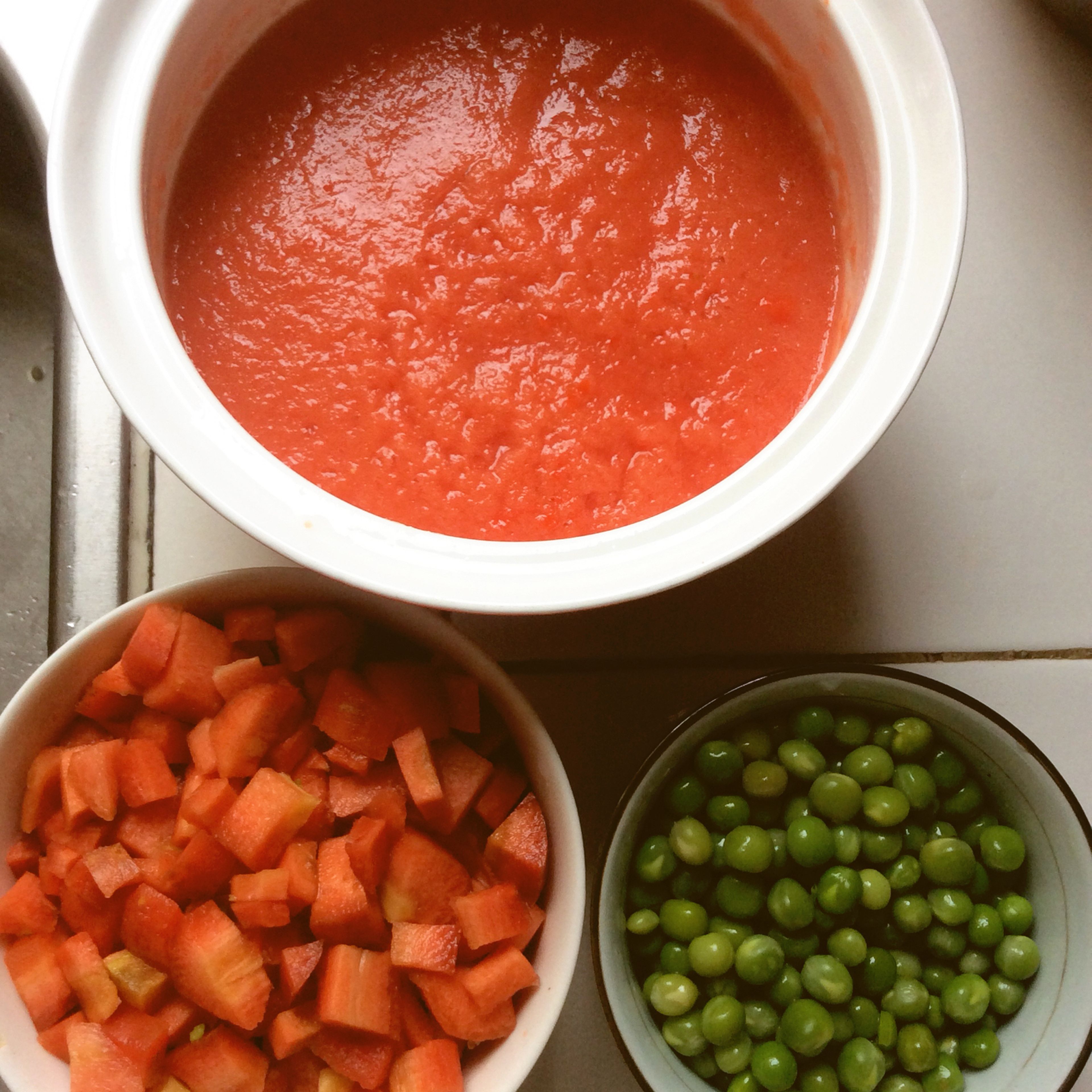 Pulse the tomatoes, bell pepper and onion into a food processor and blend to a purée.
