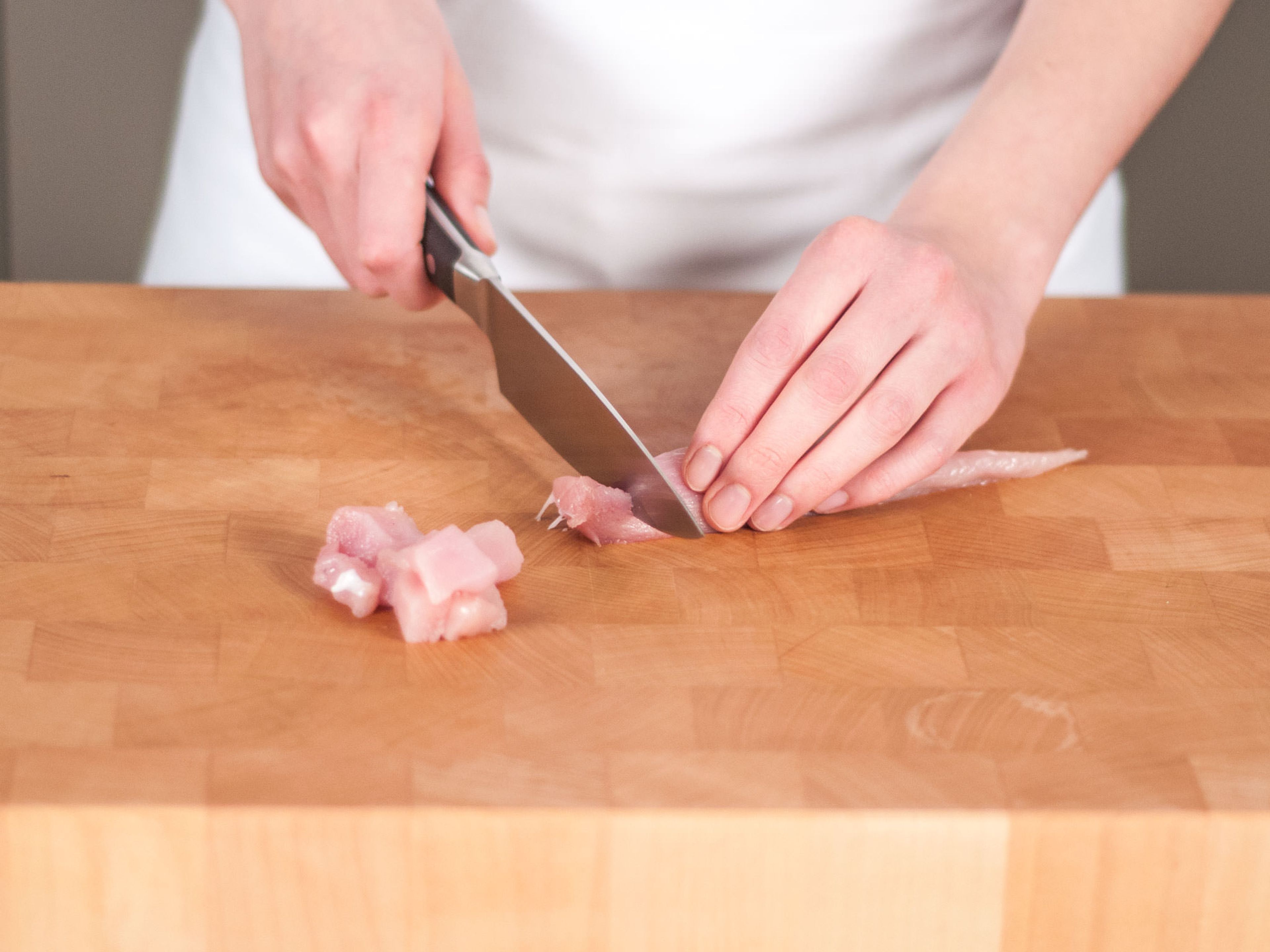 Cut chicken breast into bite-sized pieces.