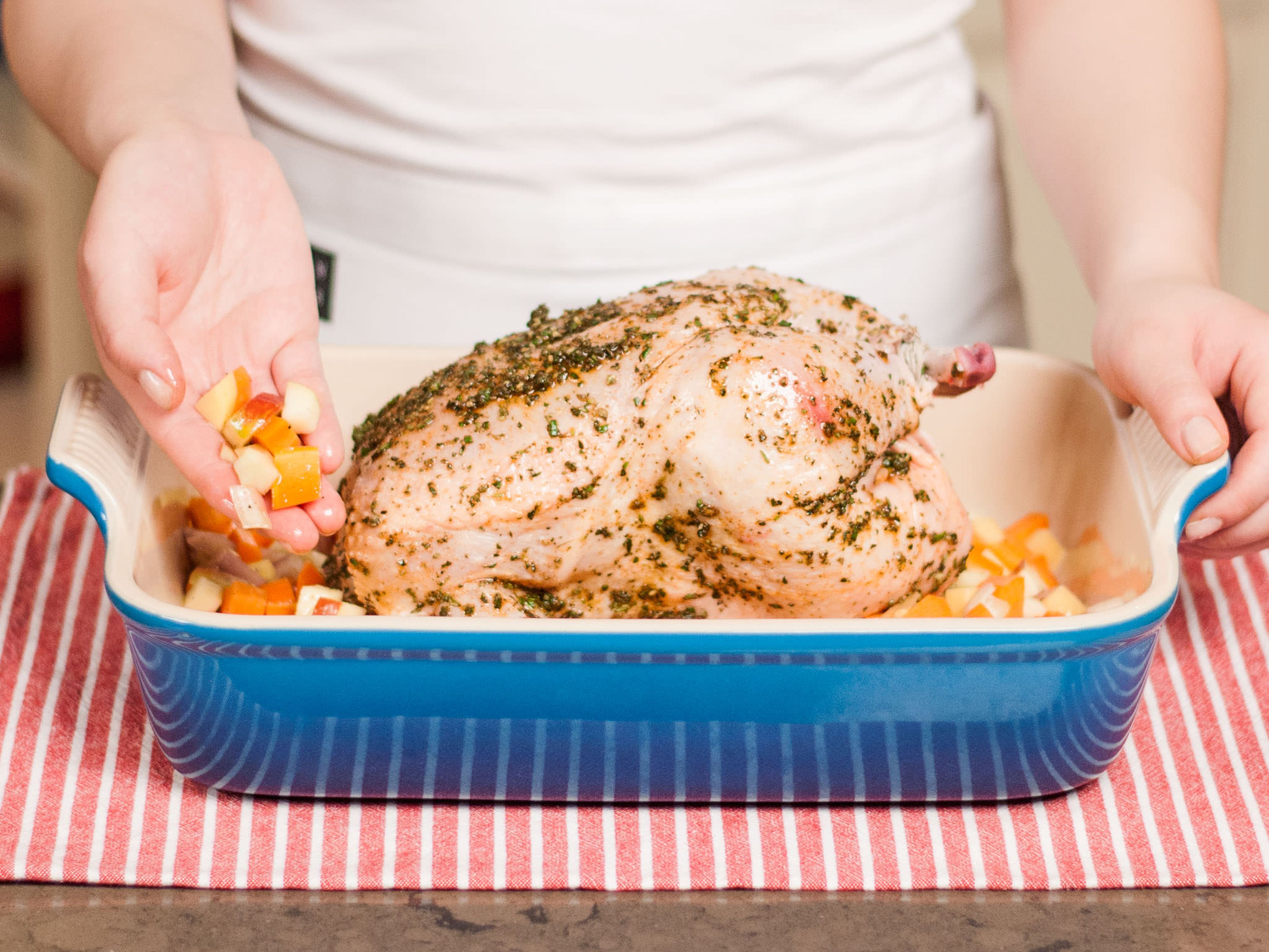 Place chicken in a baking dish and arrange the remainder of the vegetables around the chicken. Cook covered with aluminum foil in a preheated oven at 200°C/400°F for approx. 40 – 50 min. Then uncover and finish cooking at 170°C/335°F for approx. 30 min.