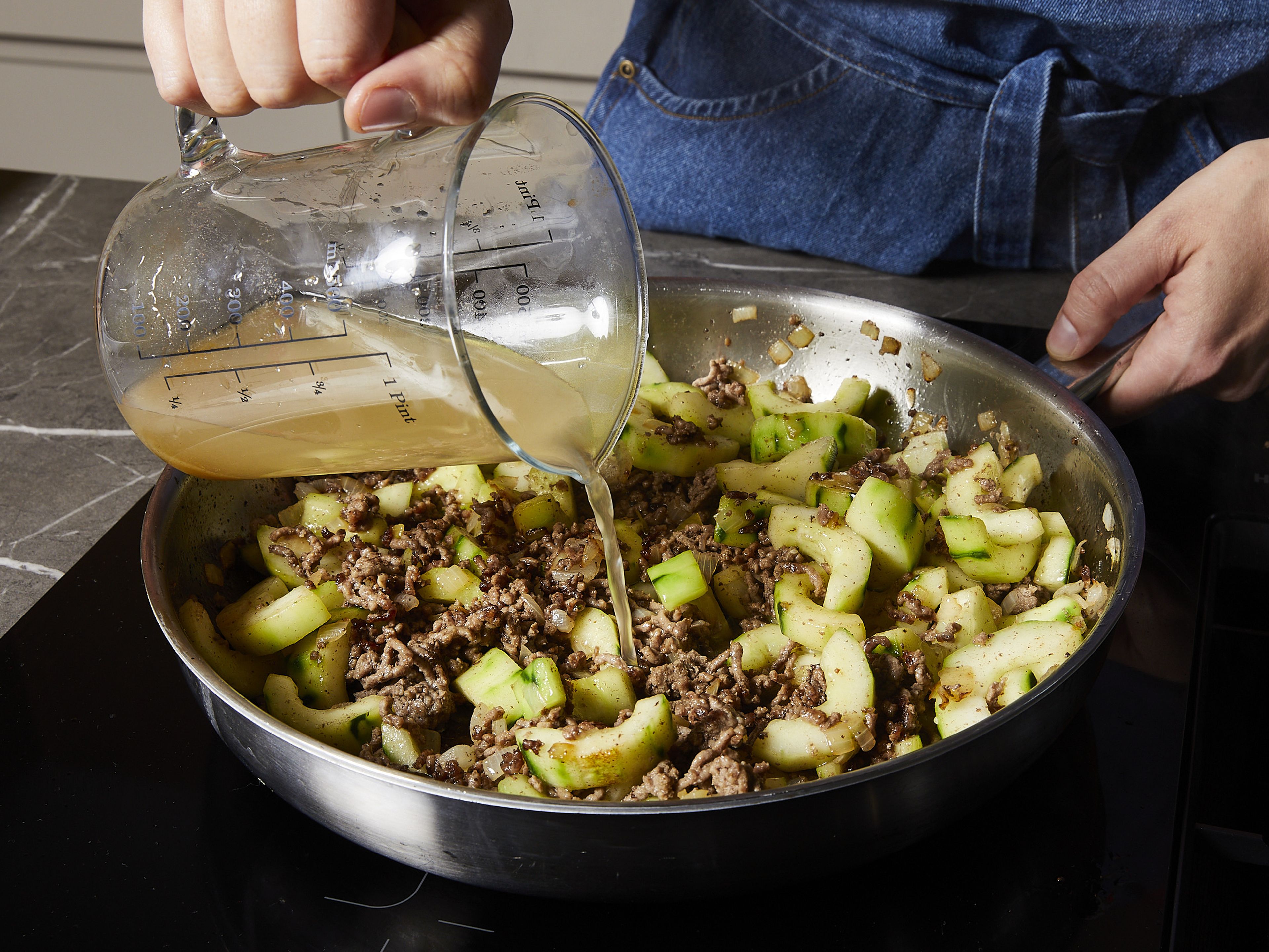 Add the beef stock and bring everything to the boil, then simmer for approx. 5-6 mins. Meanwhile, roughly chop the dill.