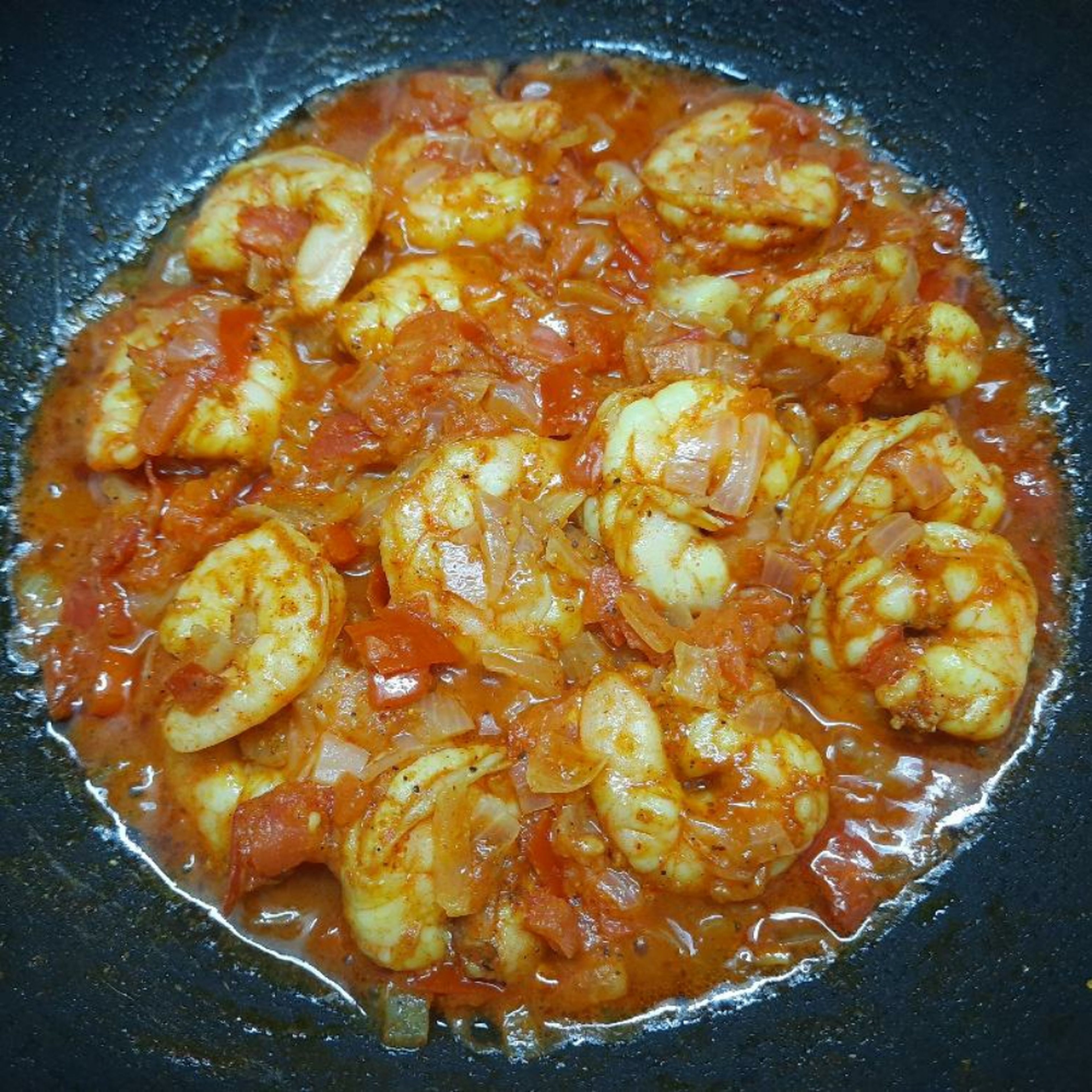 Now add the prawns and stir to mix well. Close the lid and let it cook in low flame for 5mins. When you open the lid, you should see some more water, which comes from our prawns. Mix well again.