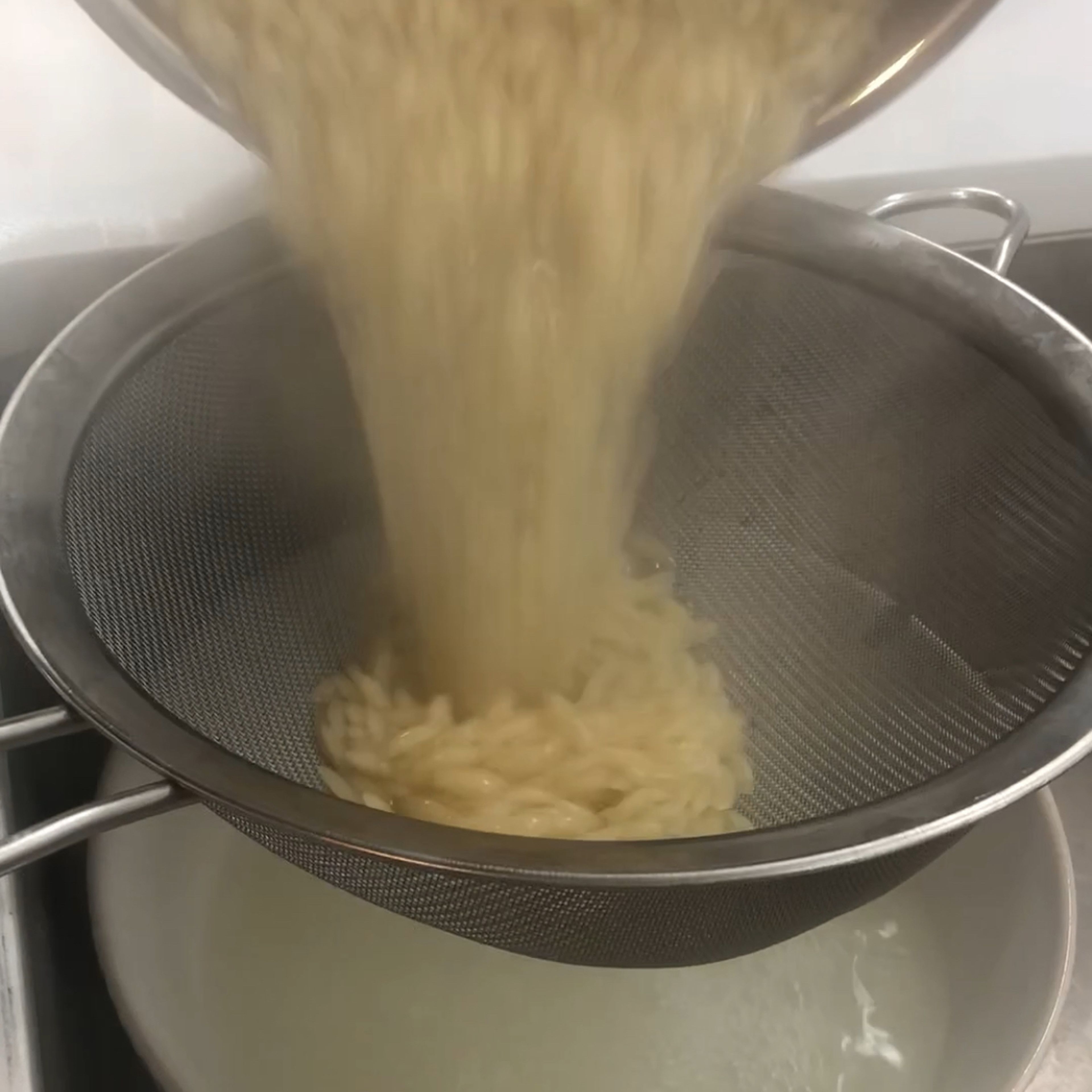 Drain the Orzo and save some of the pasta water