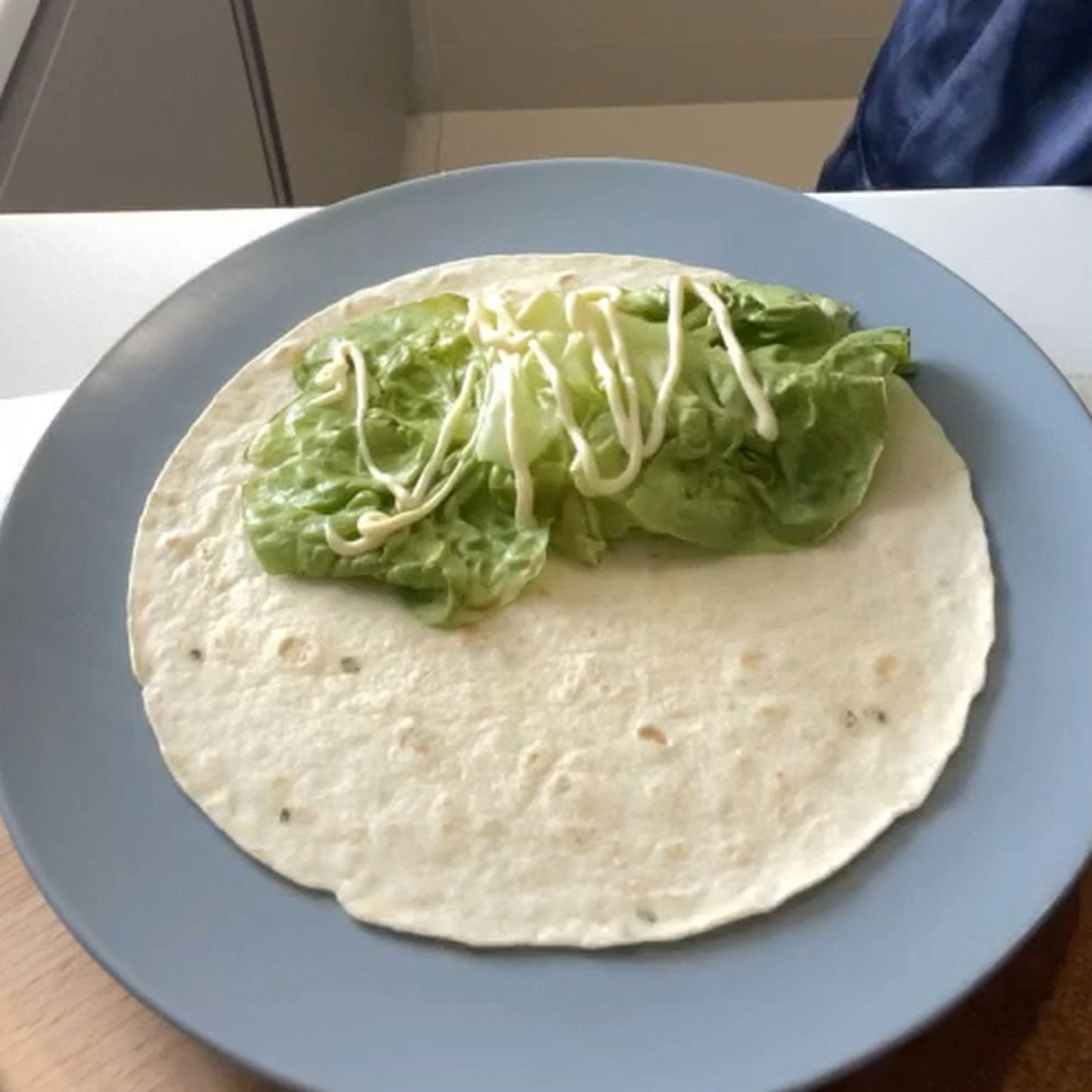 For wrapping, put lettuce and spread mayonnaise on it. Top with grilled chicken , red onion and salad dressing. Wrap to your style. 