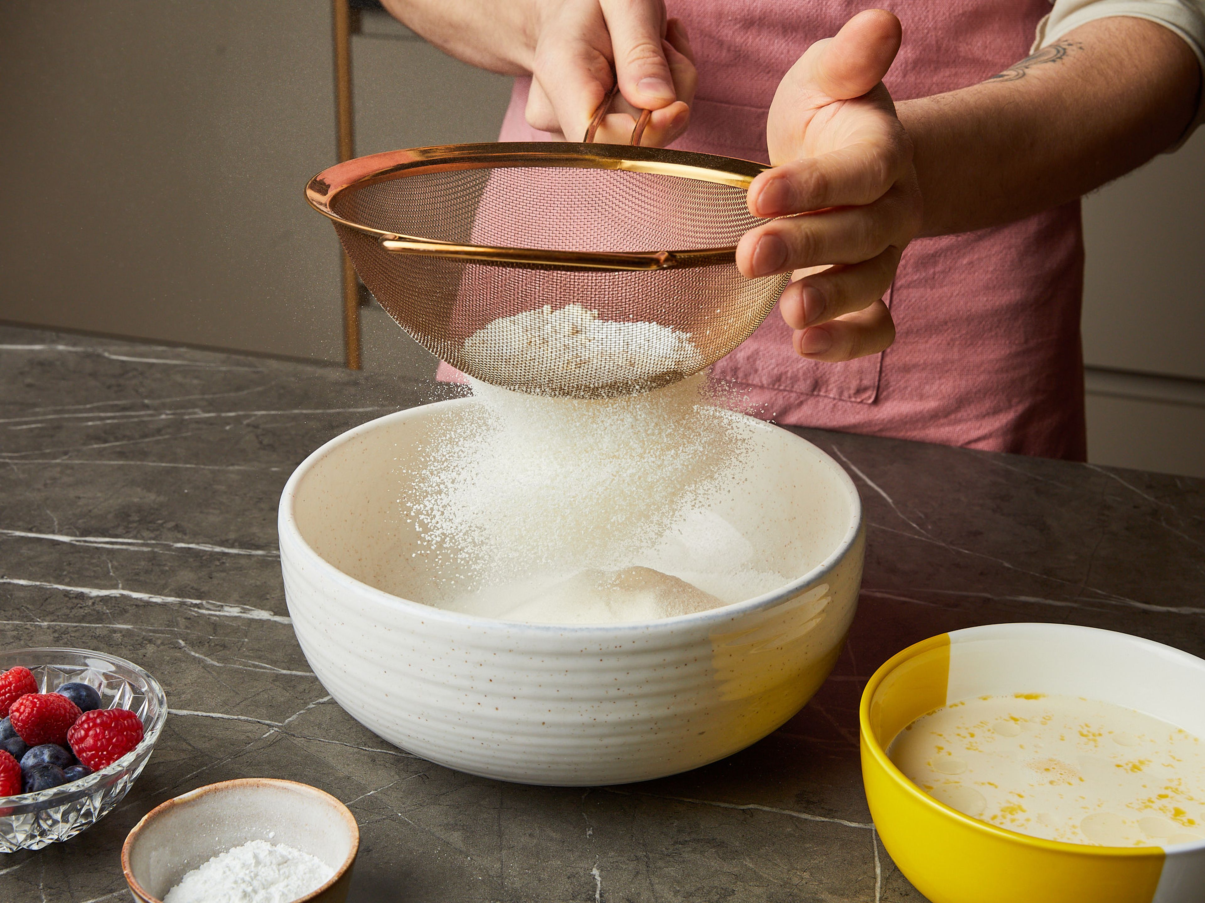 In a large bowl, sift together flour, baking powder, sugar, and salt.