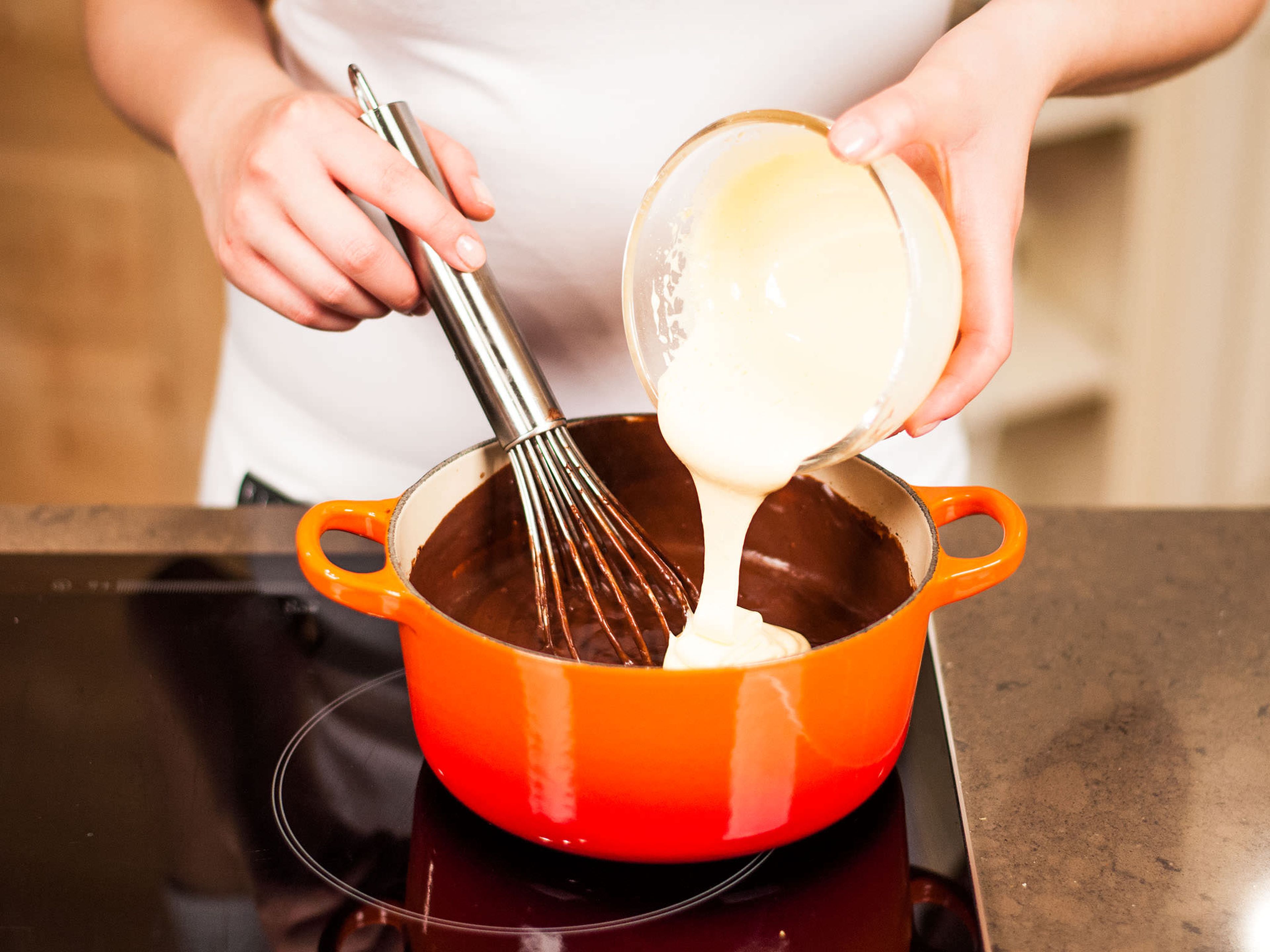 Beat sugar and egg yolks with a hand mixer until fluffy and pale. Fold immediately in the pudding. Fill in serving dishes and serve warm or cold.