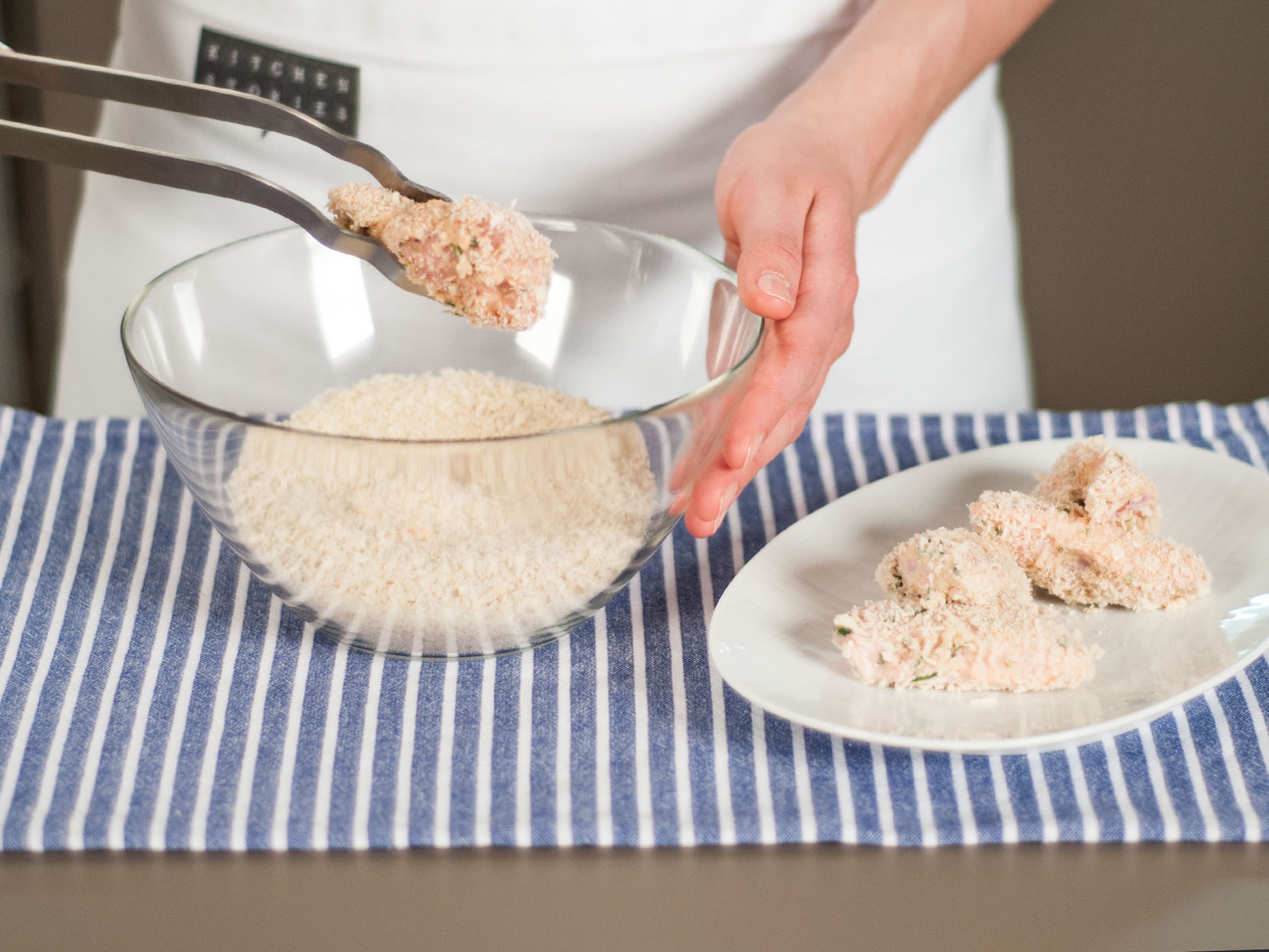 Add flour to a bowl and bread crumbs to another bowl. Toss marinated wings in flour, shaking the excess off. Dip back into the buttermilk marinade then coat chicken wings with bread crumbs, using tongs to make sure they are coated on all sides.