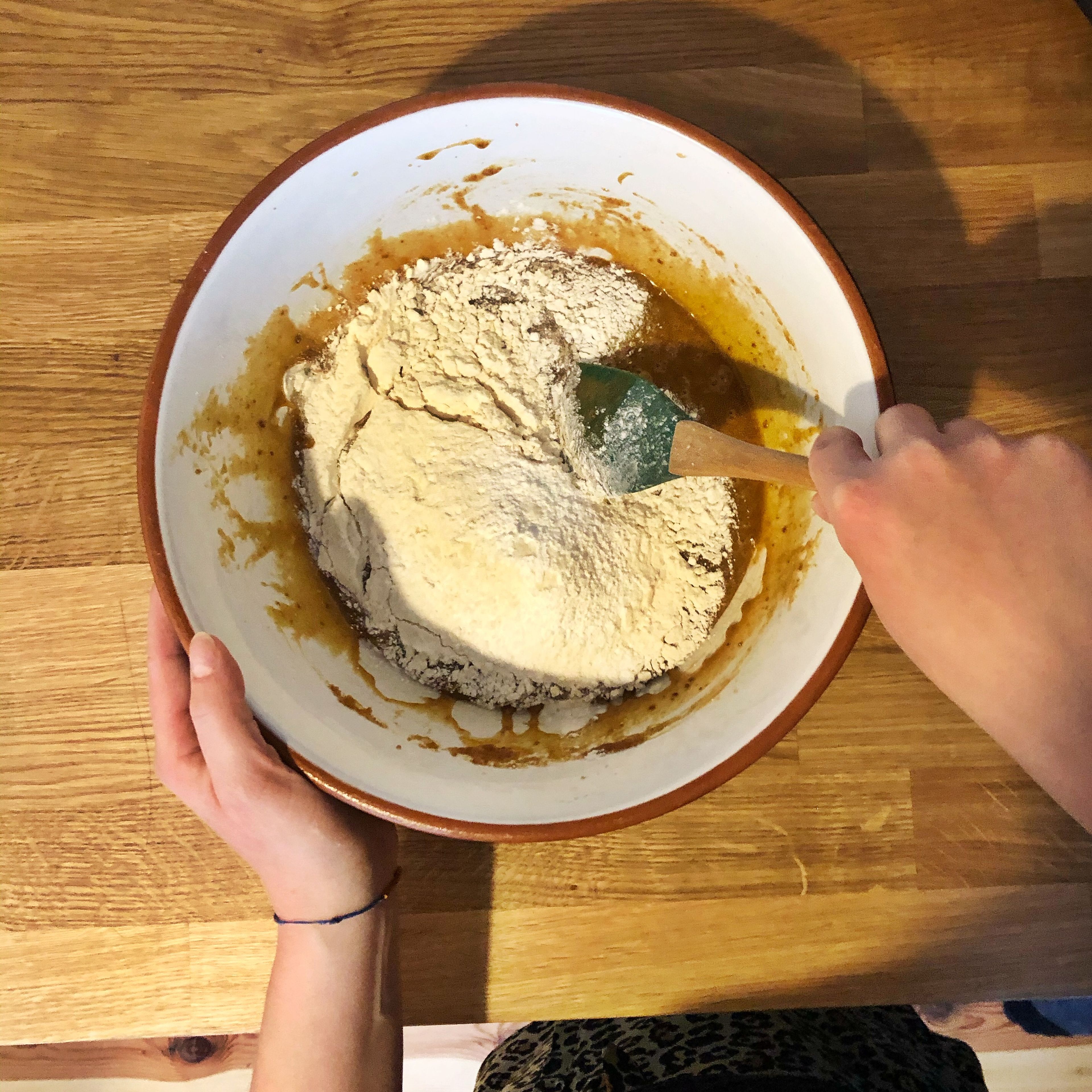 Preheat oven to 190°C/375°F. Mix brown butter, brown sugar, sugar, and vanilla extract in a large bowl. Add egg and egg yolk and stir to combine. Add flour, baking powder, baking soda, and salt and keep stirring until a smooth dough forms.
