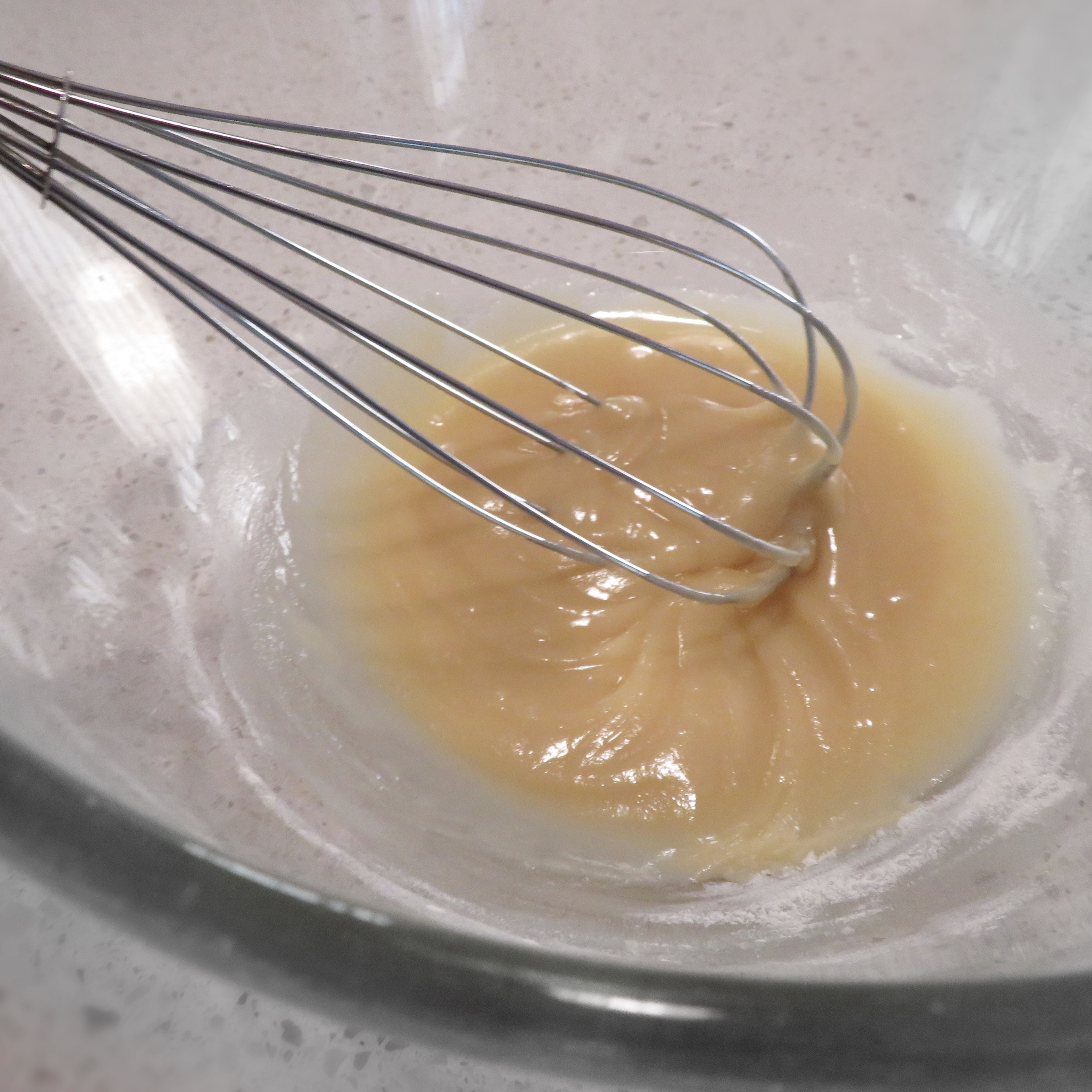 Add little bit of self raising flour at a time to oil and stir with a whisk.