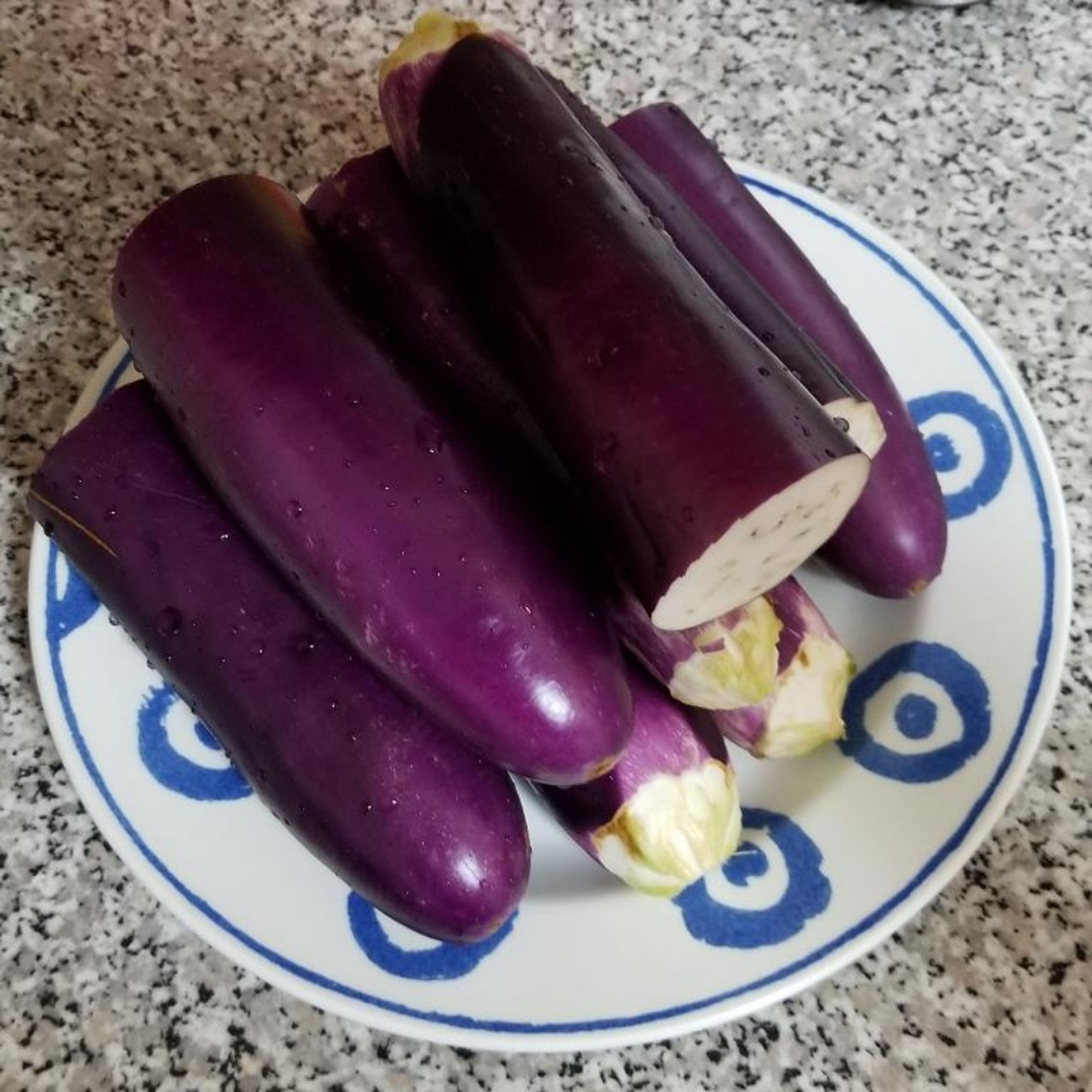 Thoroughly wash and cut the eggplants in half.