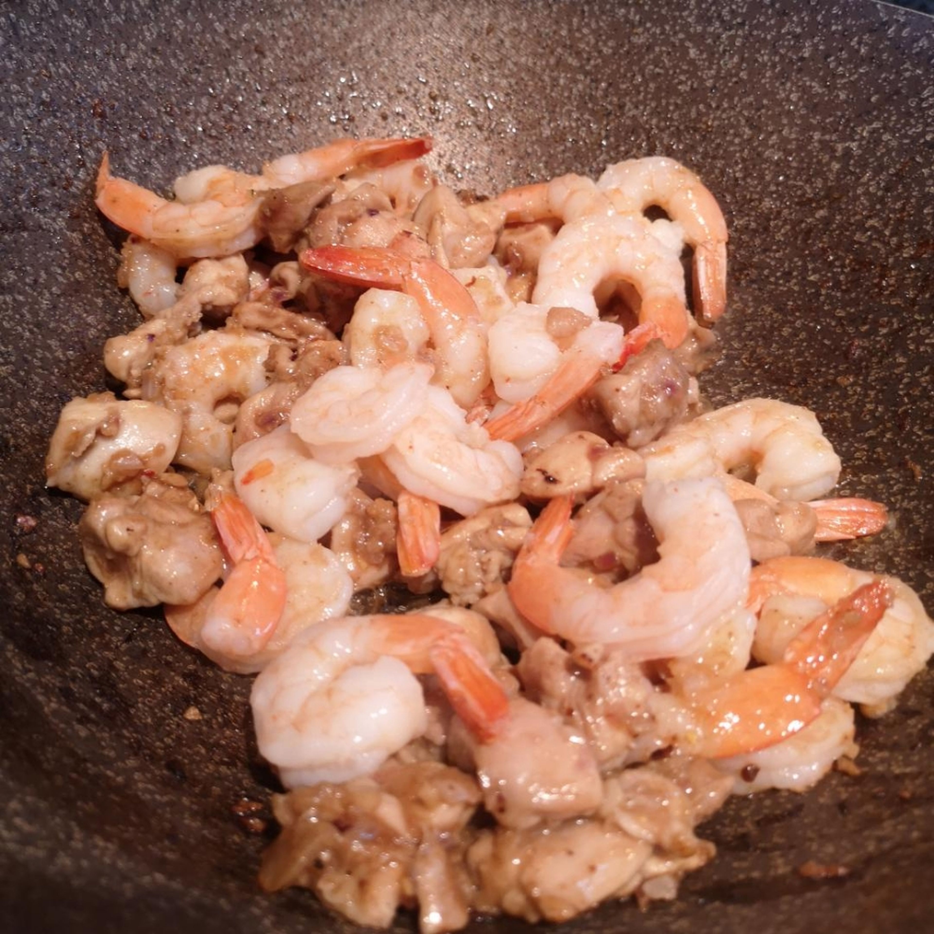 after 10 minutes add shrimp to cook with the chicken