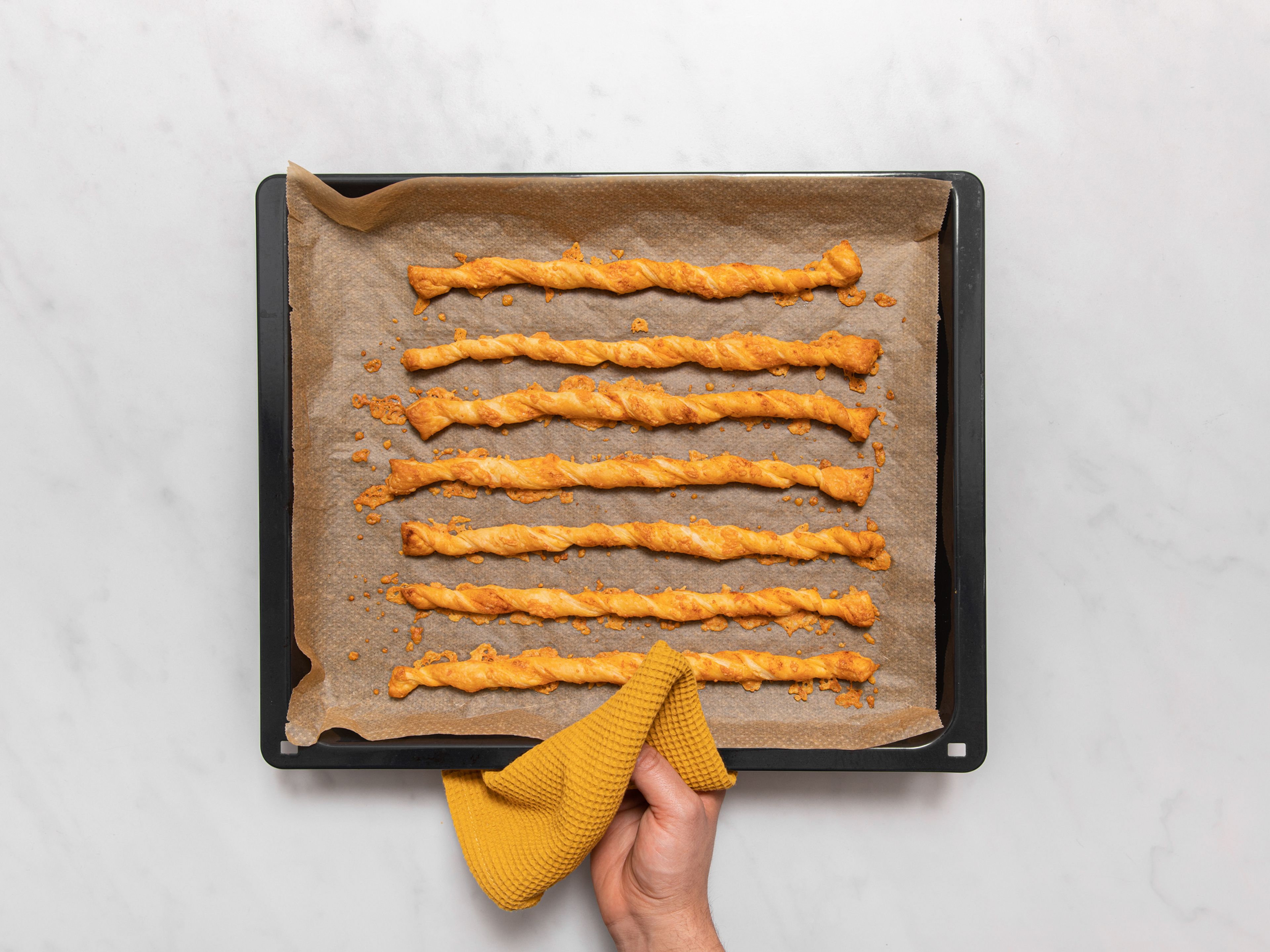 Preheat the oven to 190°C/375°F. Bake cheese straws for approx. 20 min., or until straws are dry to the touch and golden brown all over. Remove and let cool a bit before serving. Enjoy warm or at room temperature!