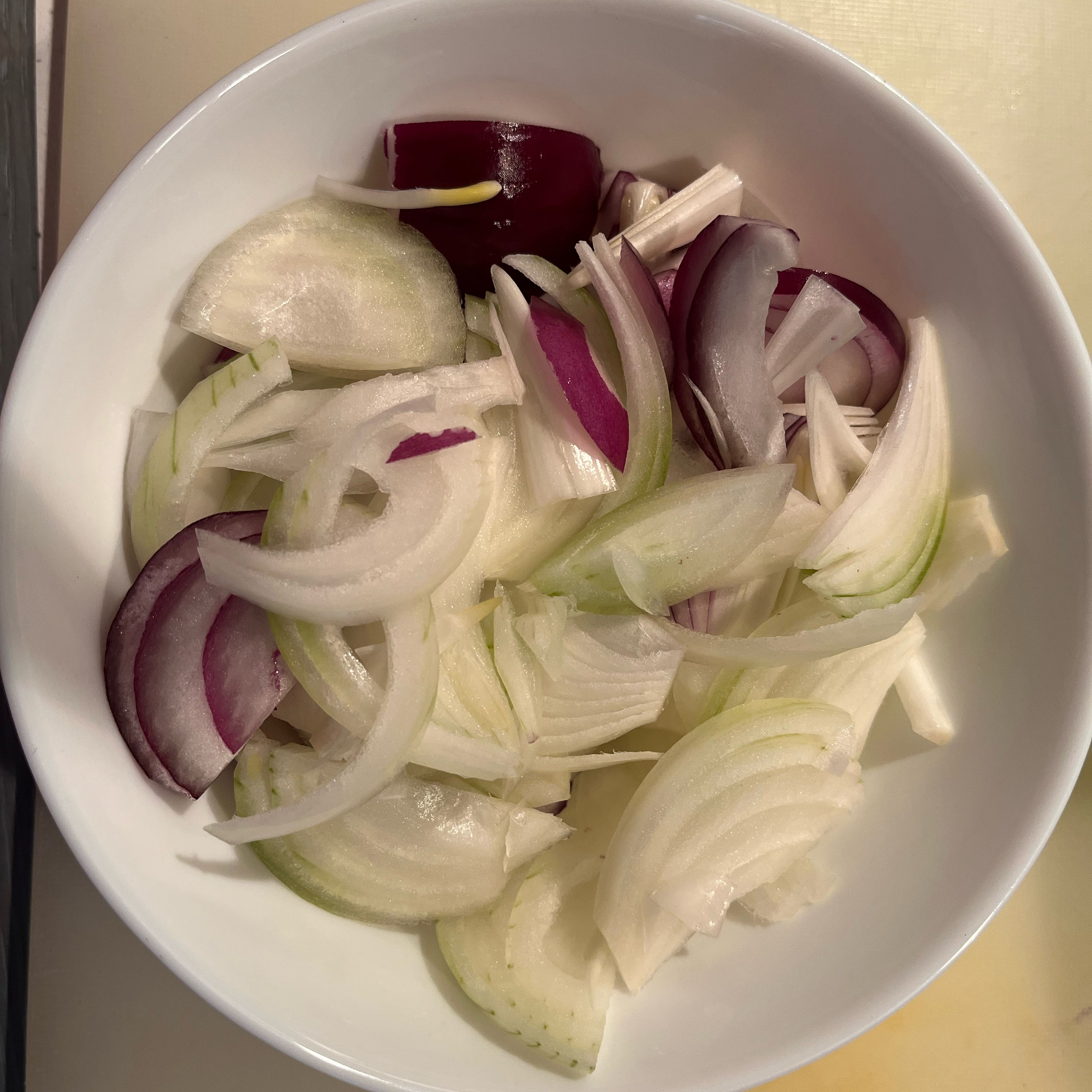 Peel and cut onion into wedges.