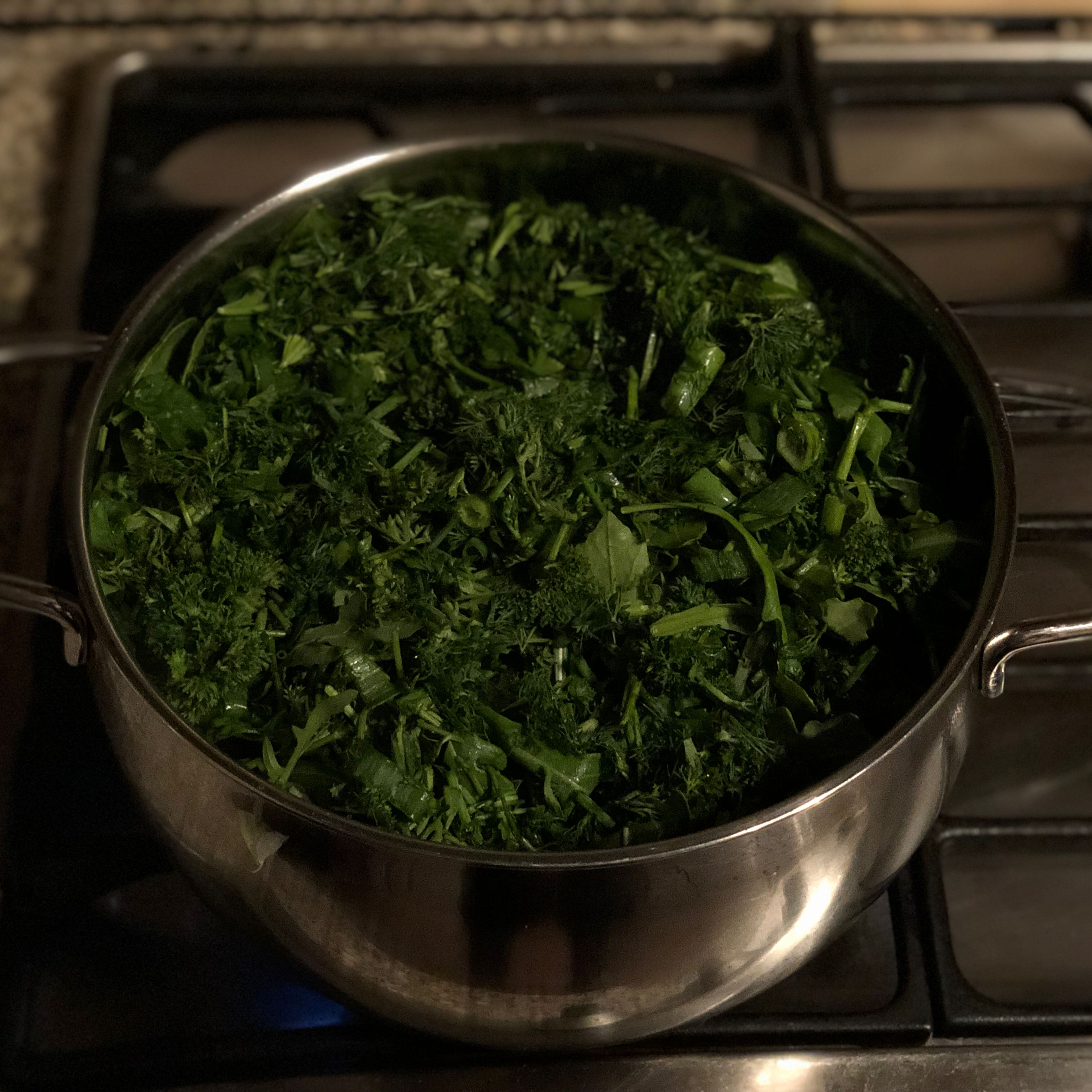 Chop spinach, arugula, dill, tarragon, parsley , springs onion and cilantro. Combine in a stockpot with the olive oil and cook in a low heat until smooth. 15-20 minutes. Season with salt and pepper and set aside to cool.
