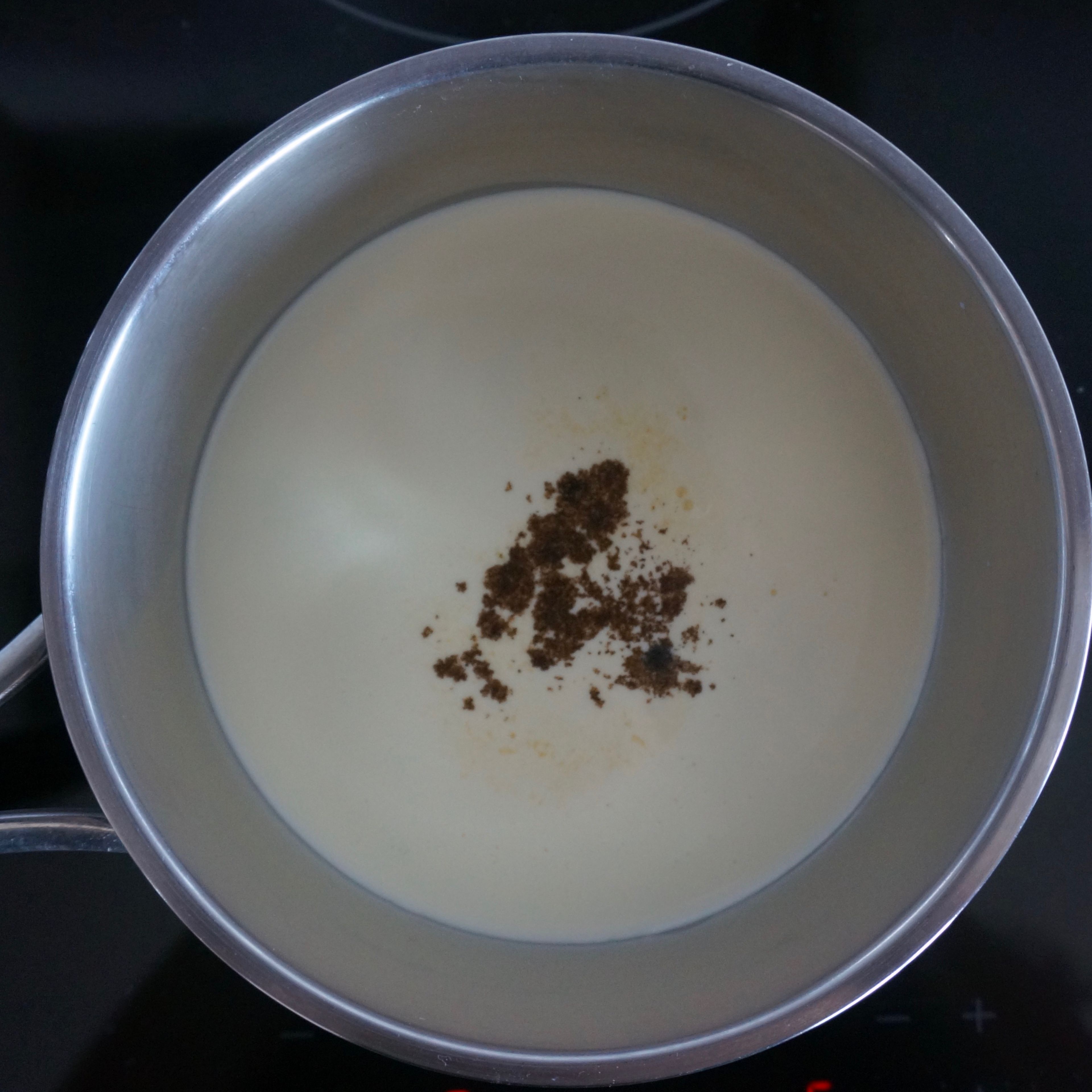 Meanwhile, in a medium saucepan, heat cream, milk, sugar, vanilla sugar, and vanilla seeds on medium heat and bring just to a boil until sugar dissolves. Remove from heat and leave for 5 minutes.