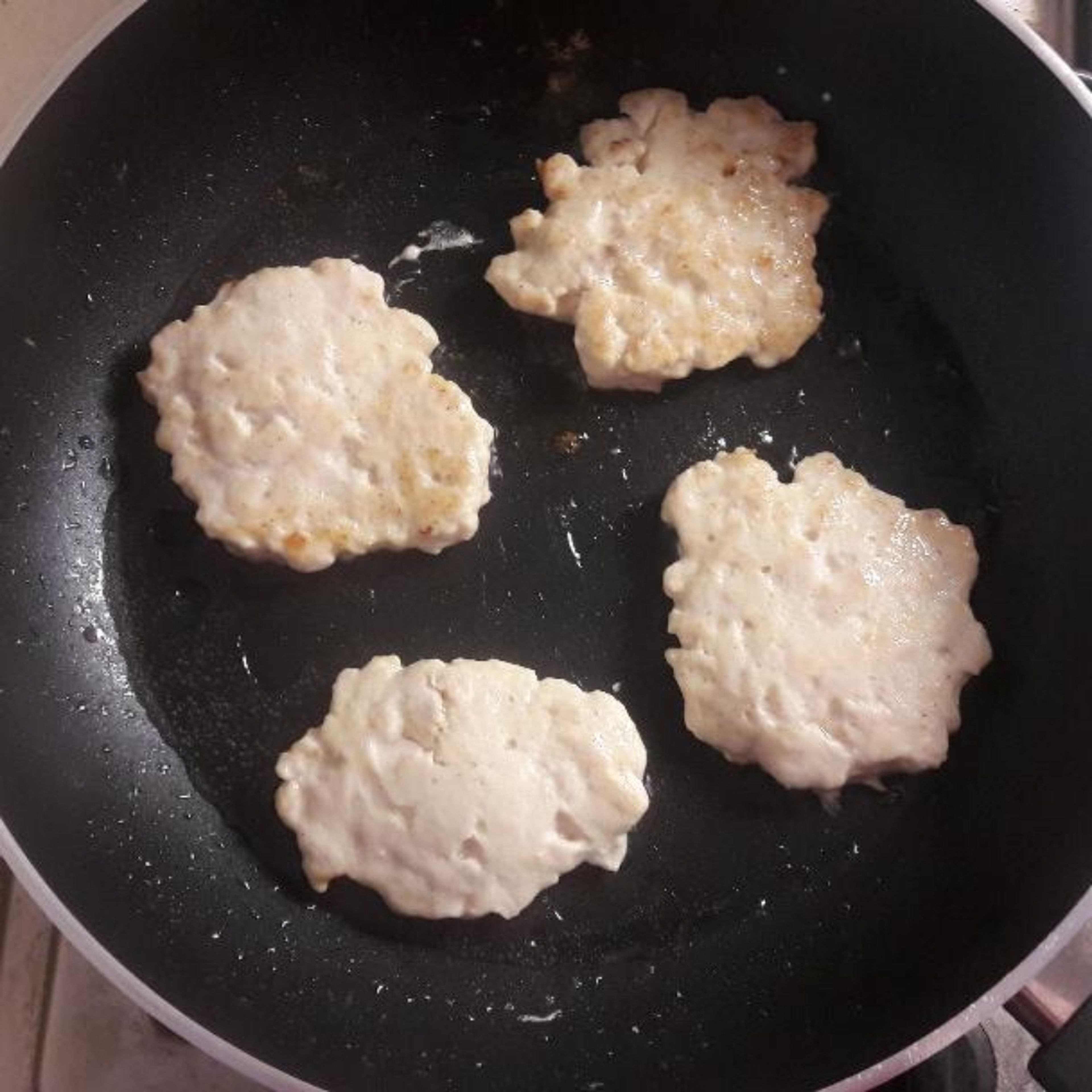 Chicken is ready to be fried. Prehit a pan with oil, then use a table spoon to put chopped chicken in a pan. Fry on both sides. Hint 1: use a spatula and a fork to pick up cutlets from a pan. Hint 2: If cutlets crumble after being fried, next time add more eggs(e.g. 1,5. Not handy, but still it'll help)