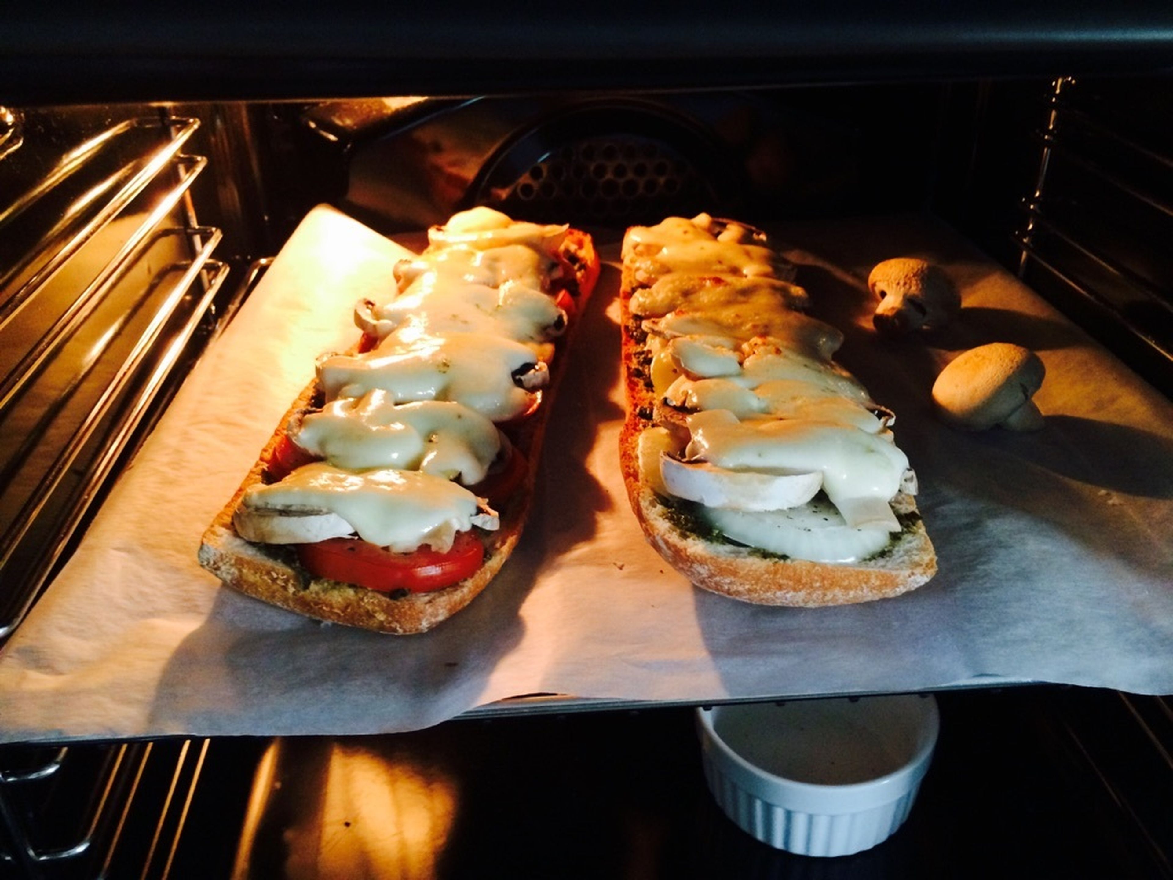 Put in oven and bake for approx. 15 – 20 min. at 200°C/390°F until mozzarella has melted.