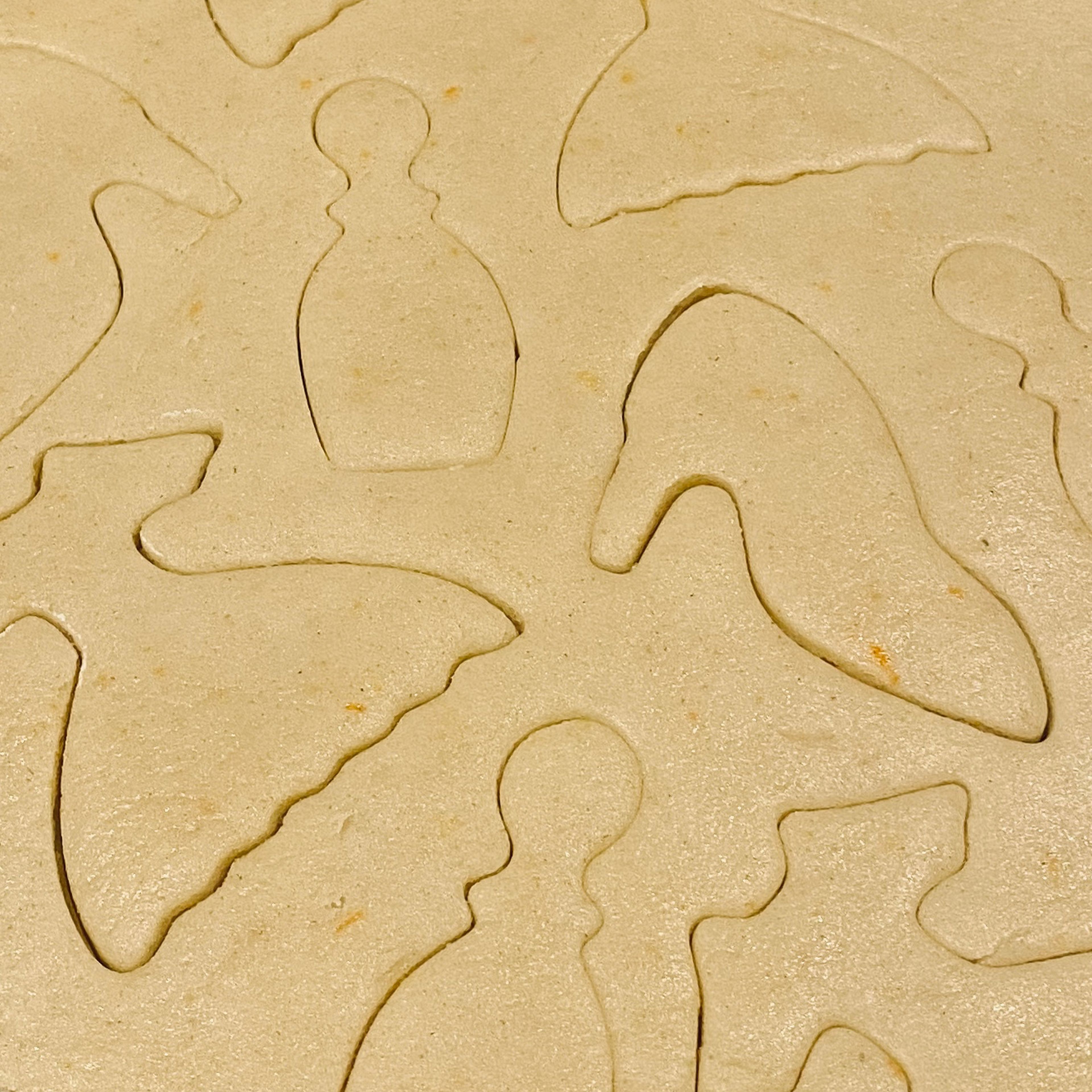 Add a light wash of flour over your counter top and roll out your dough to 1/4 inches thick. The get any style cookie cutter you own and start pressing the shape into the dough.