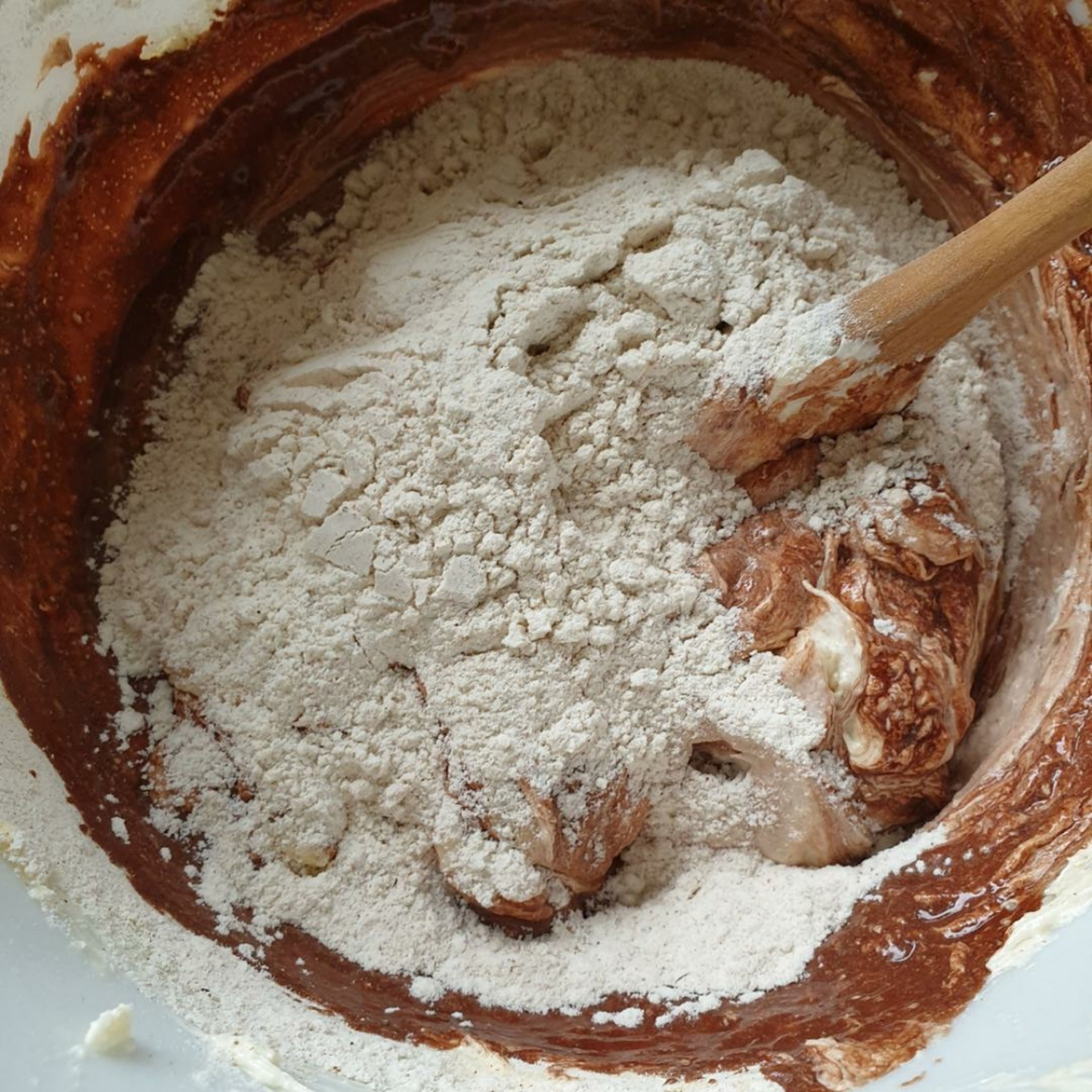 Alternatively add spoonfuls of the flour mixture and dissolved cocoa into the cake batter and combine well.