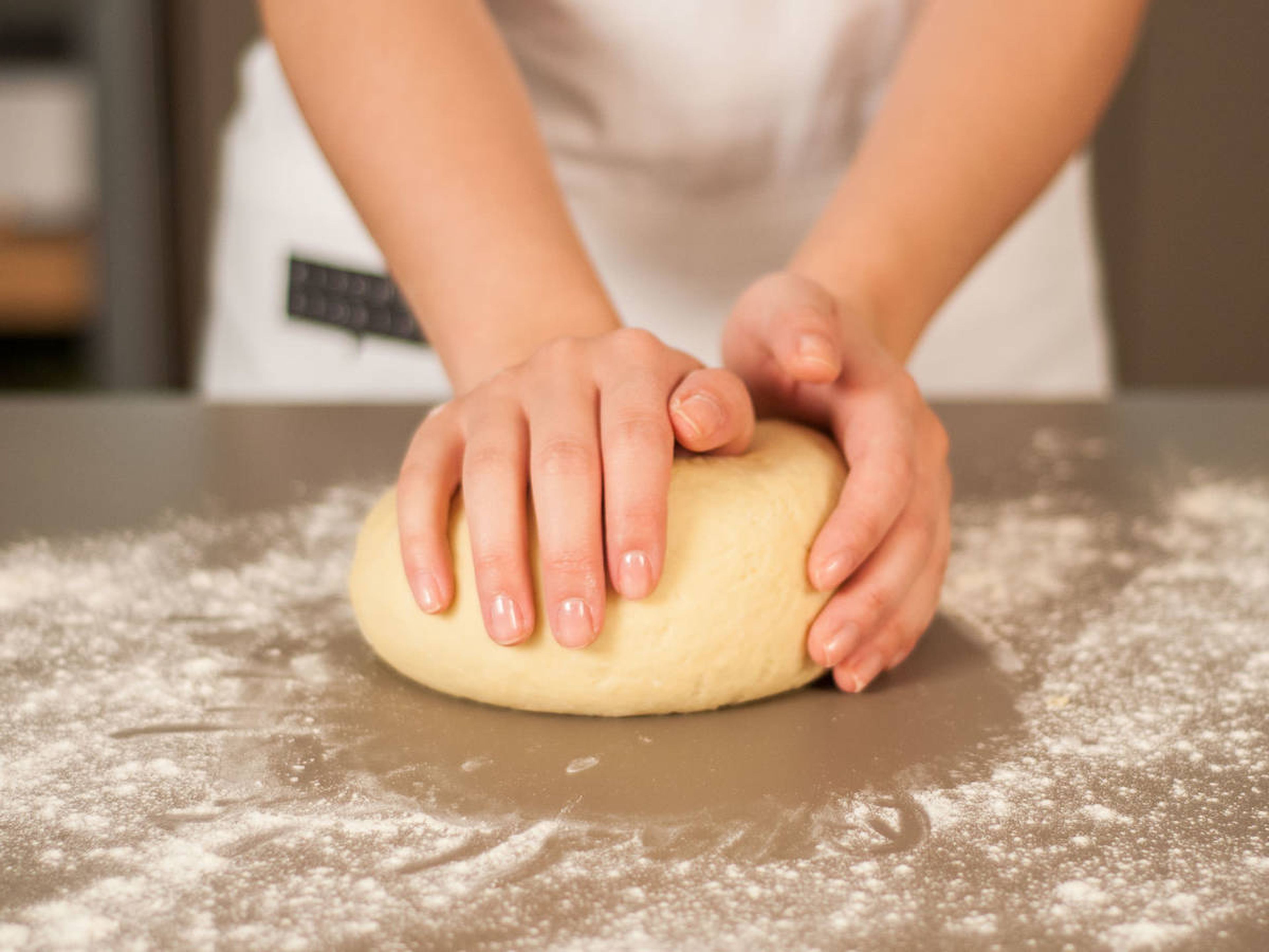 Transfer dough to a lightly floured surface and continue to knead by hand.