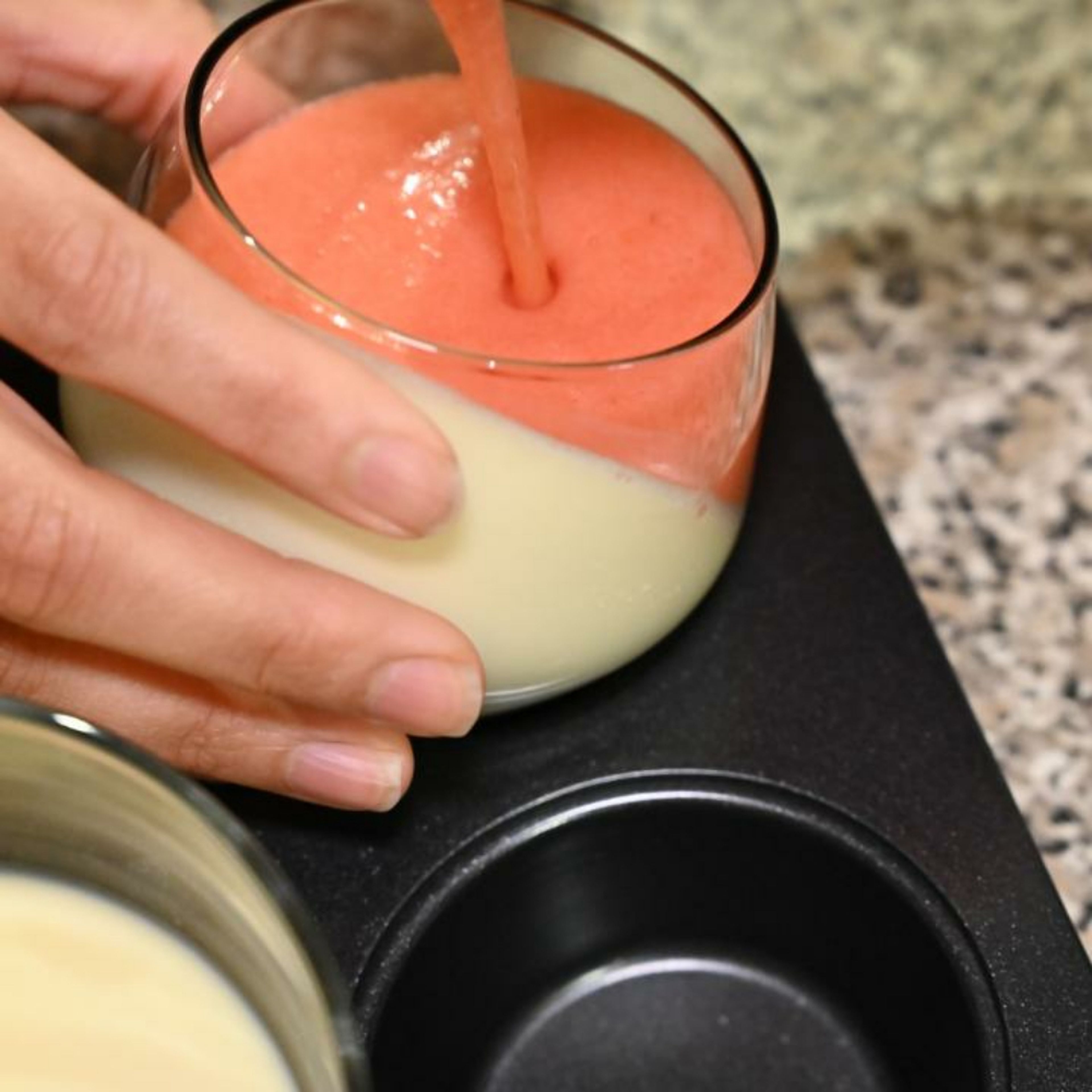 Straighten the dessert cups and pour the strawberry coulis onto the dessert cups.