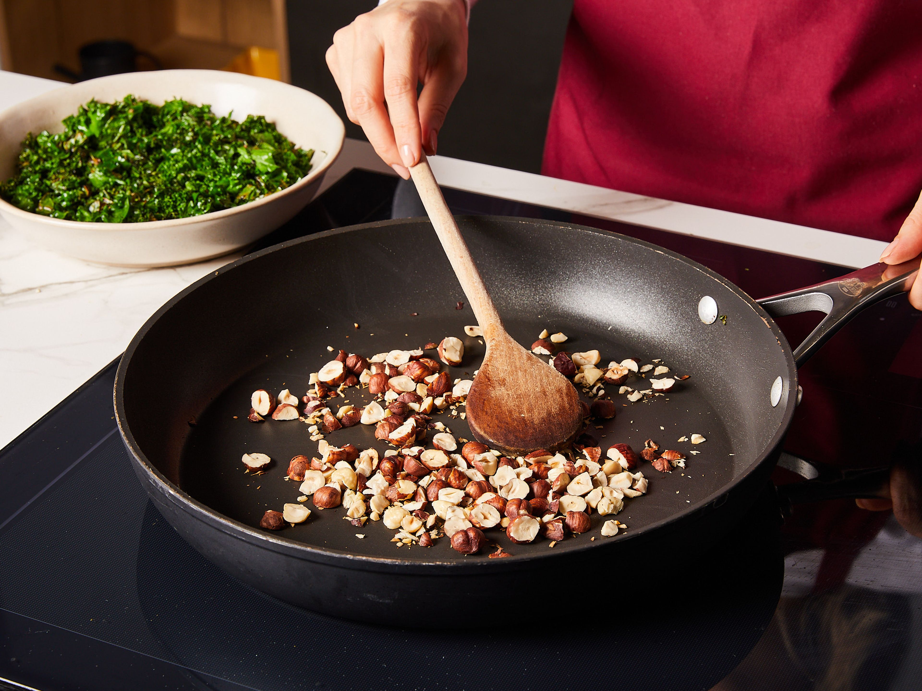 While pasta is cooking, melt ⅓ of the butter in a large pan over medium heat. Add chopped kale and sauté for approx. 4–5 min. until crispy and lightly browned. Season kale with a pinch of salt, remove from the pan and set aside. In the same pan, toast chopped hazelnuts with no additional fat until golden brown and fragrant for approx. 2–3 min. Remove from the pan and set aside.