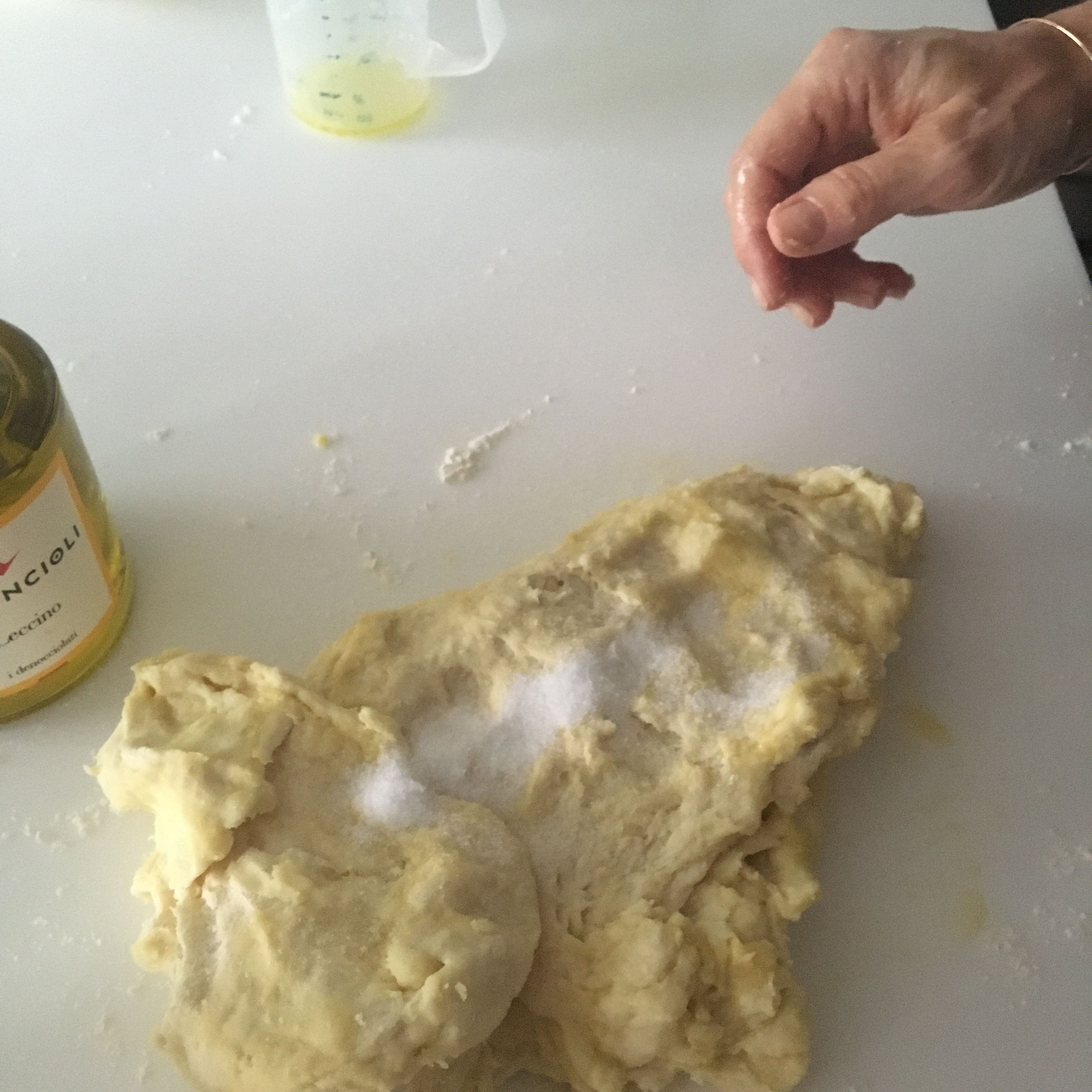 Flatten the dough out and add salt to it