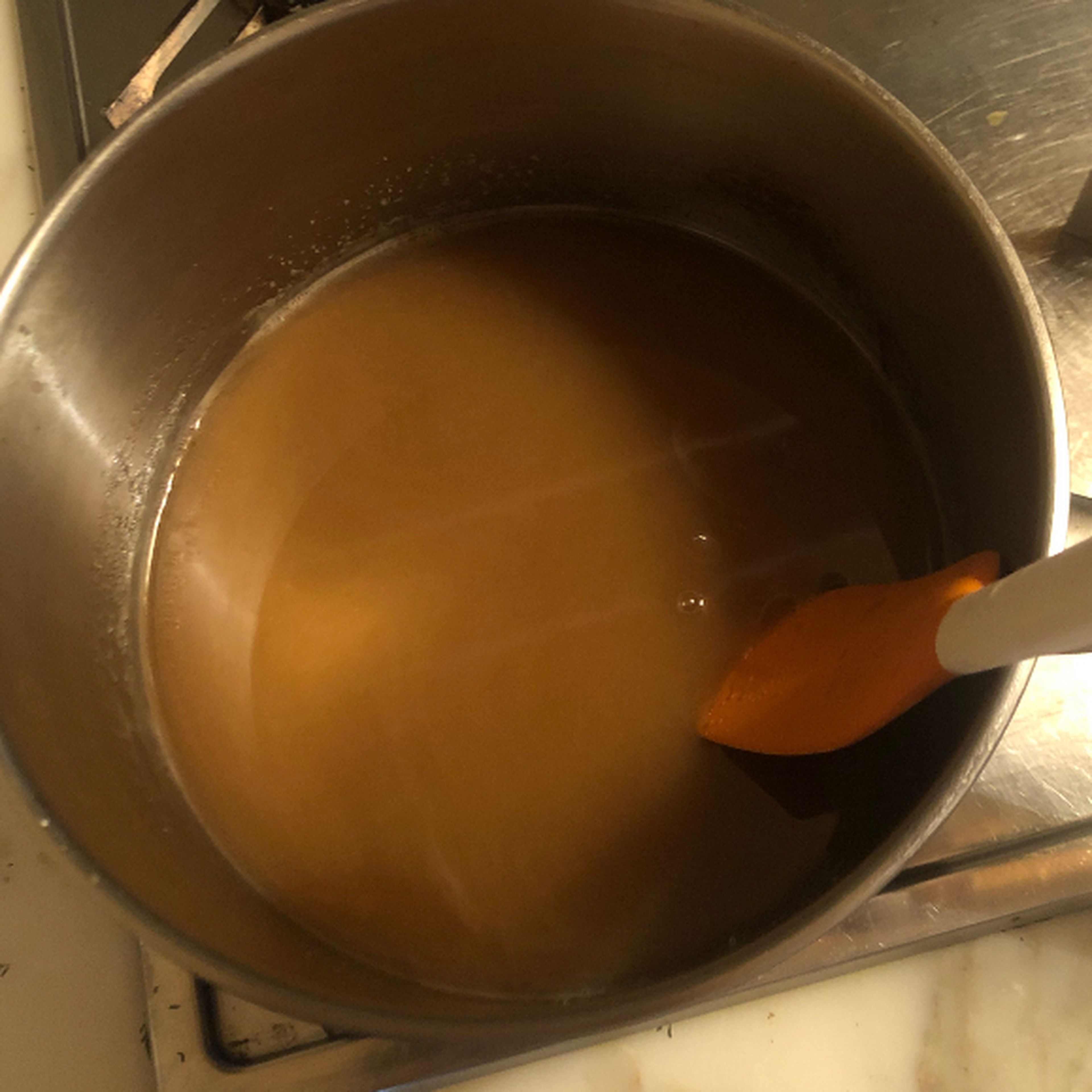 In a pan, heat the water and sugar until you get a caramel colouring.