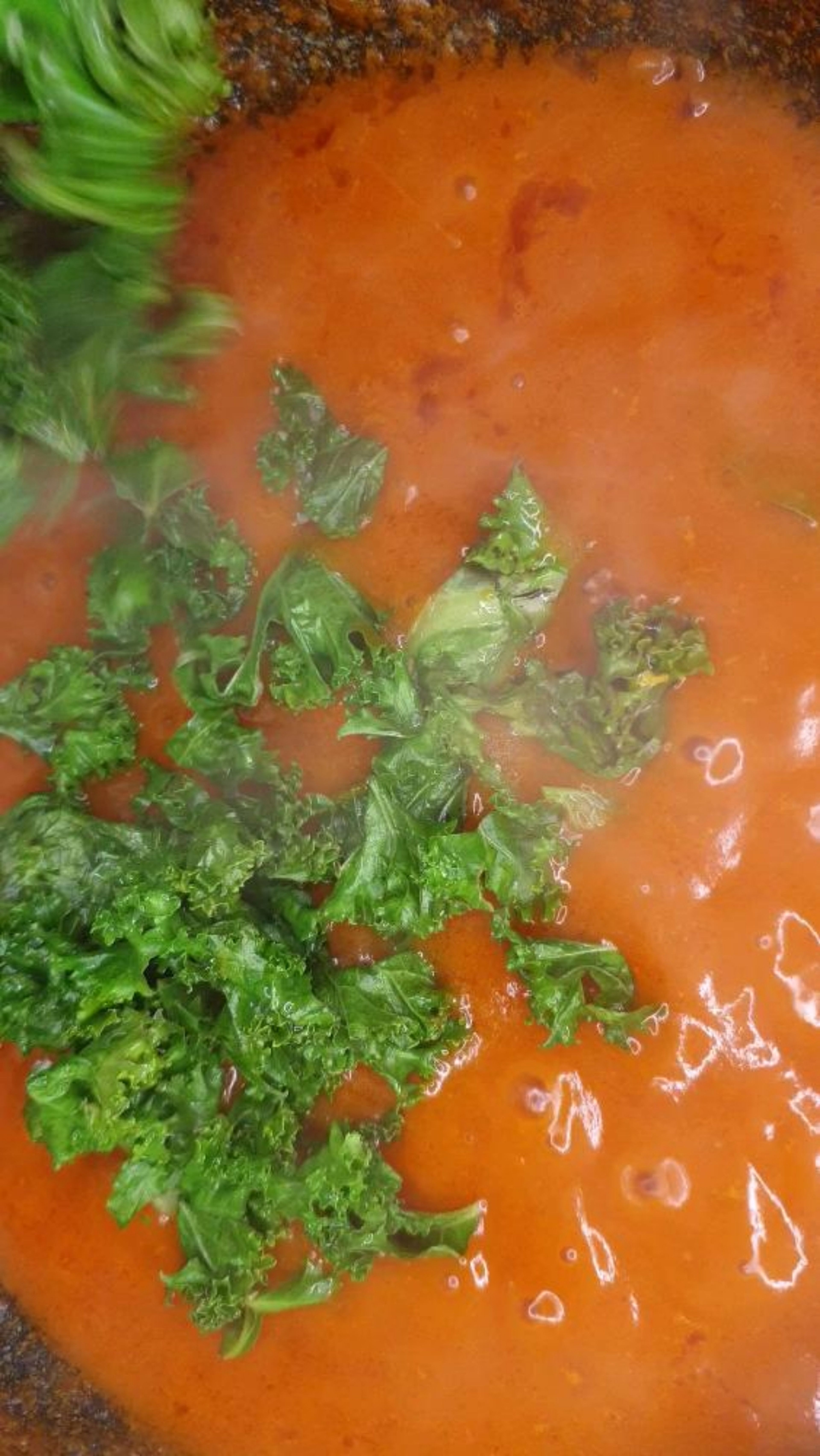 Rinse, blanch and drain excess water from Kale and add to stew.