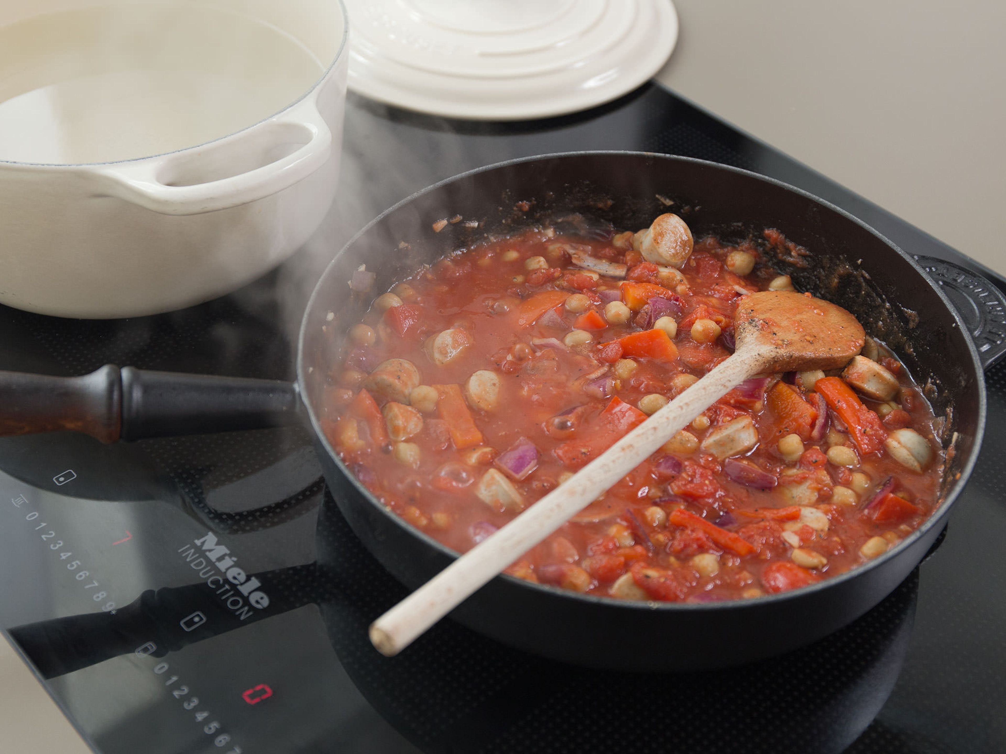 Add tomatoes and season with salt and pepper. Let simmer for approx. 10 – 15 min., uncovered. In the meantime, bring water to a boil in a large saucepan, add salt, and cook penne according to package instructions, until al dente.