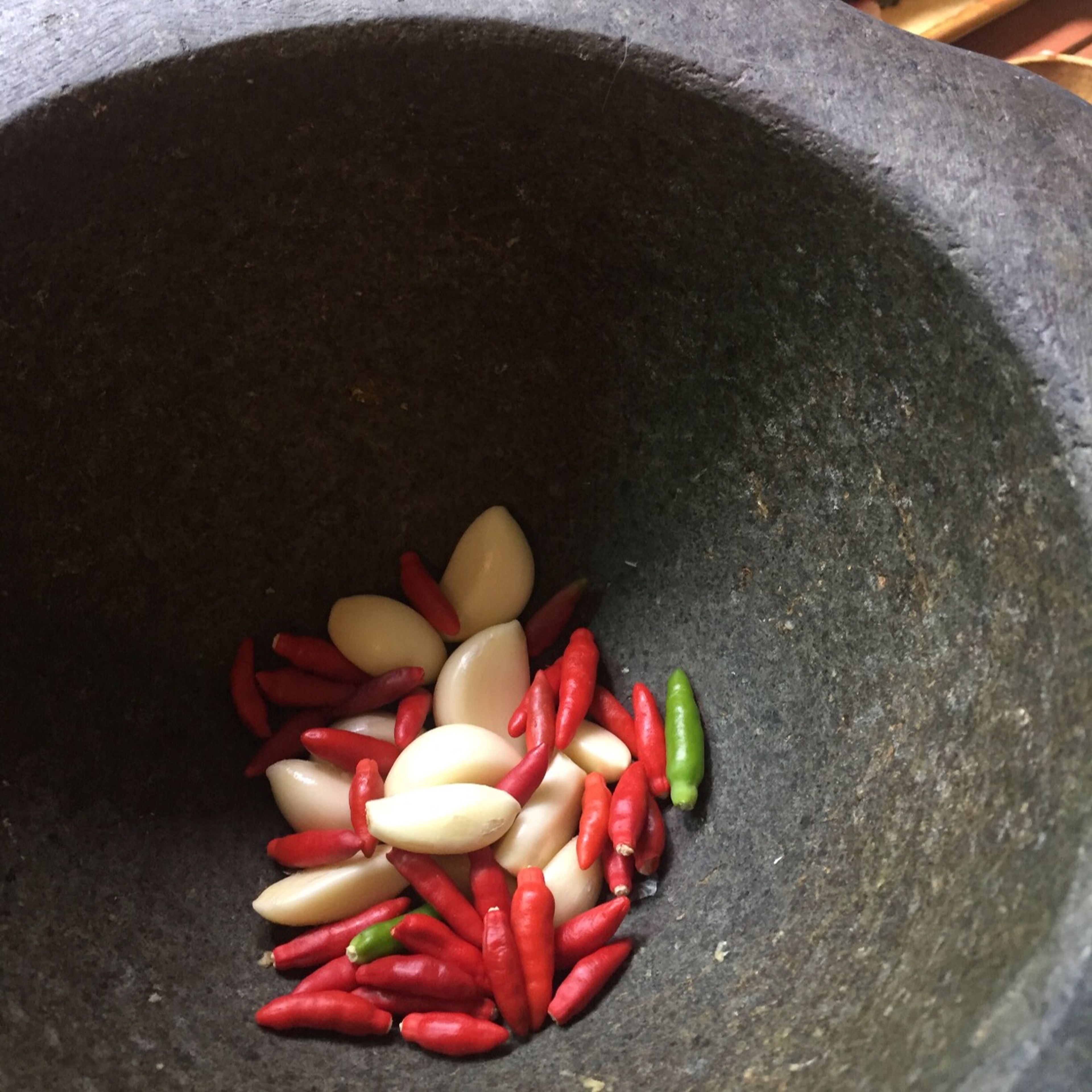 Use a mortar and pestle to pound the garlic and chilies paste. Set a side for later.