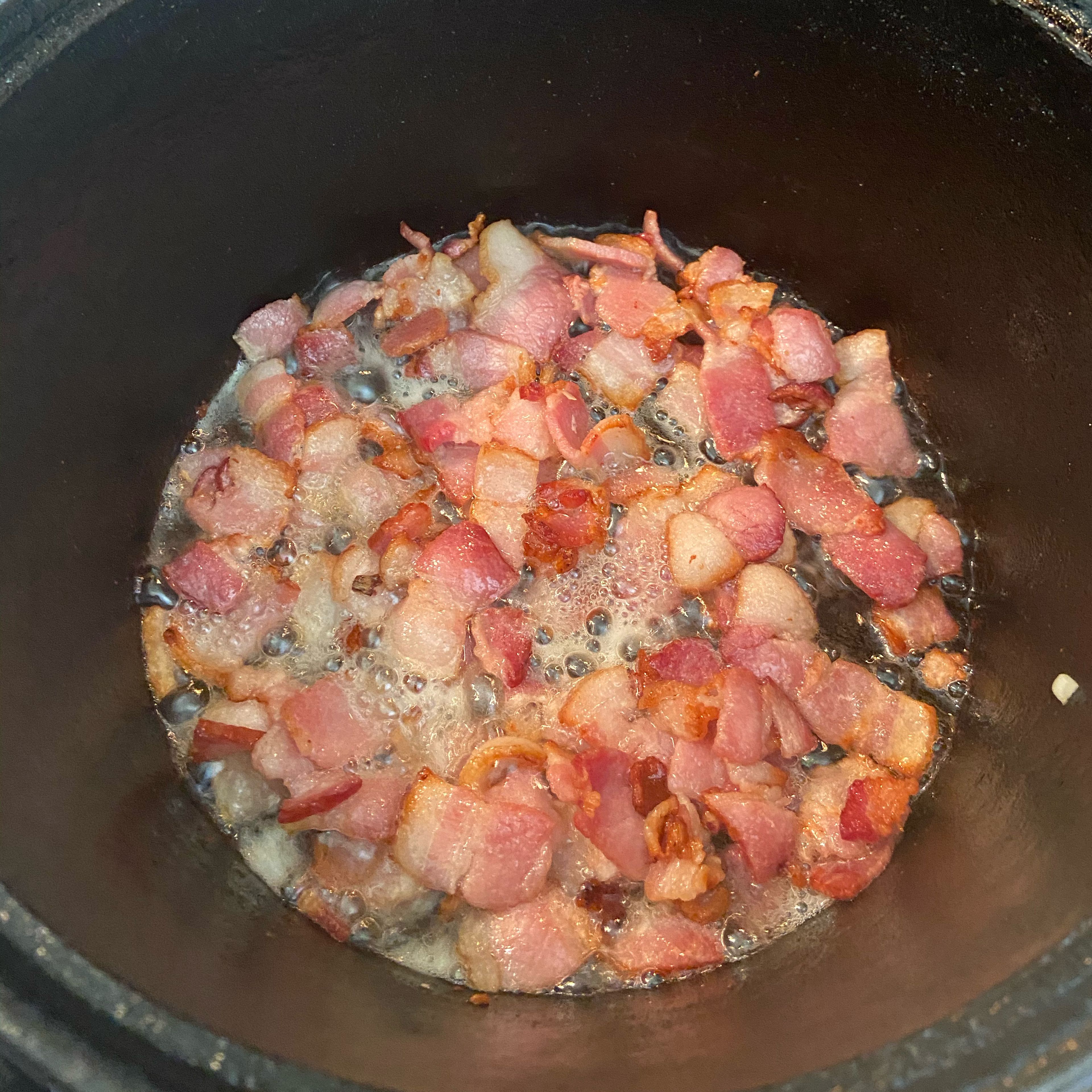 Once the bacon has browned add the onions, green beans, and garlic and sauté for another 2 to 3 minutes.￼ don’t worry about draining that grease, you want all that delicious flavor.￼