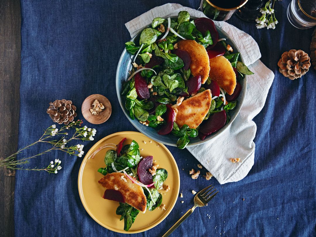 Hearty winter salad with fried cheese, beets, and walnuts