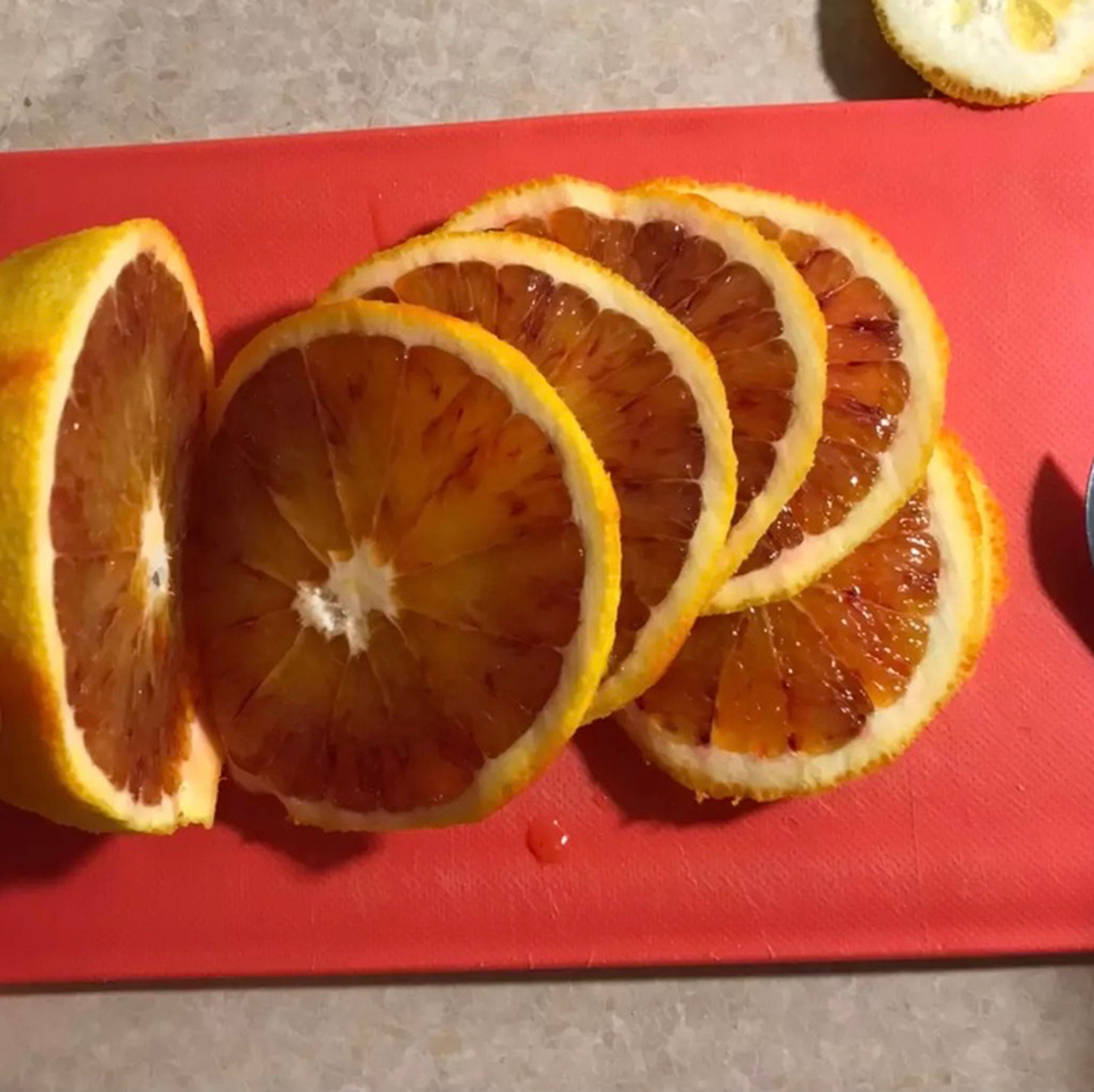 Then cut the orange peel into thin slices. Put it in the dish.
