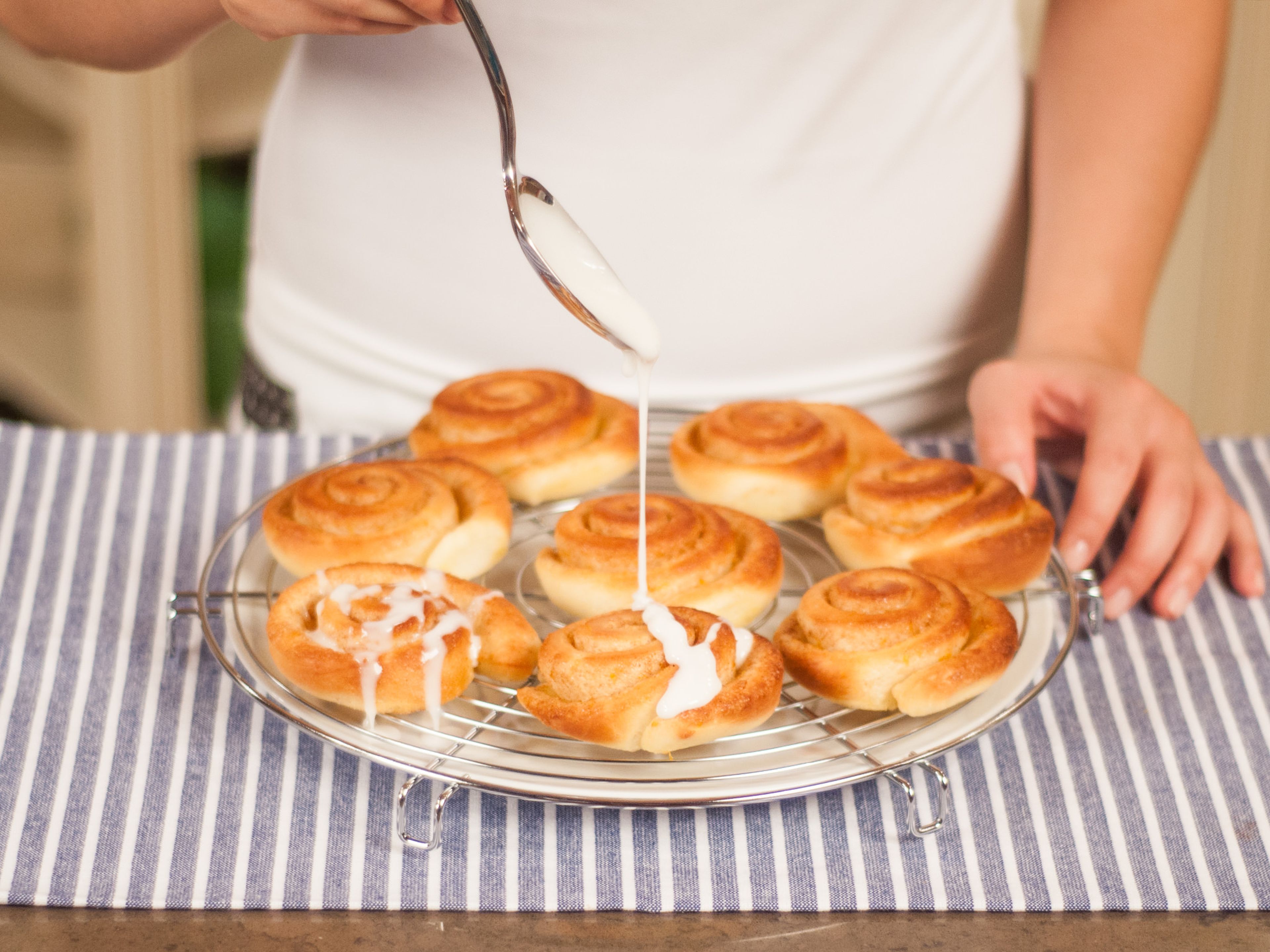 Take the rolls out of the oven and let cool for 10 min. on a rack. Drizzle the icing over the rolls and decorate to your preference. Serve while still warm.
