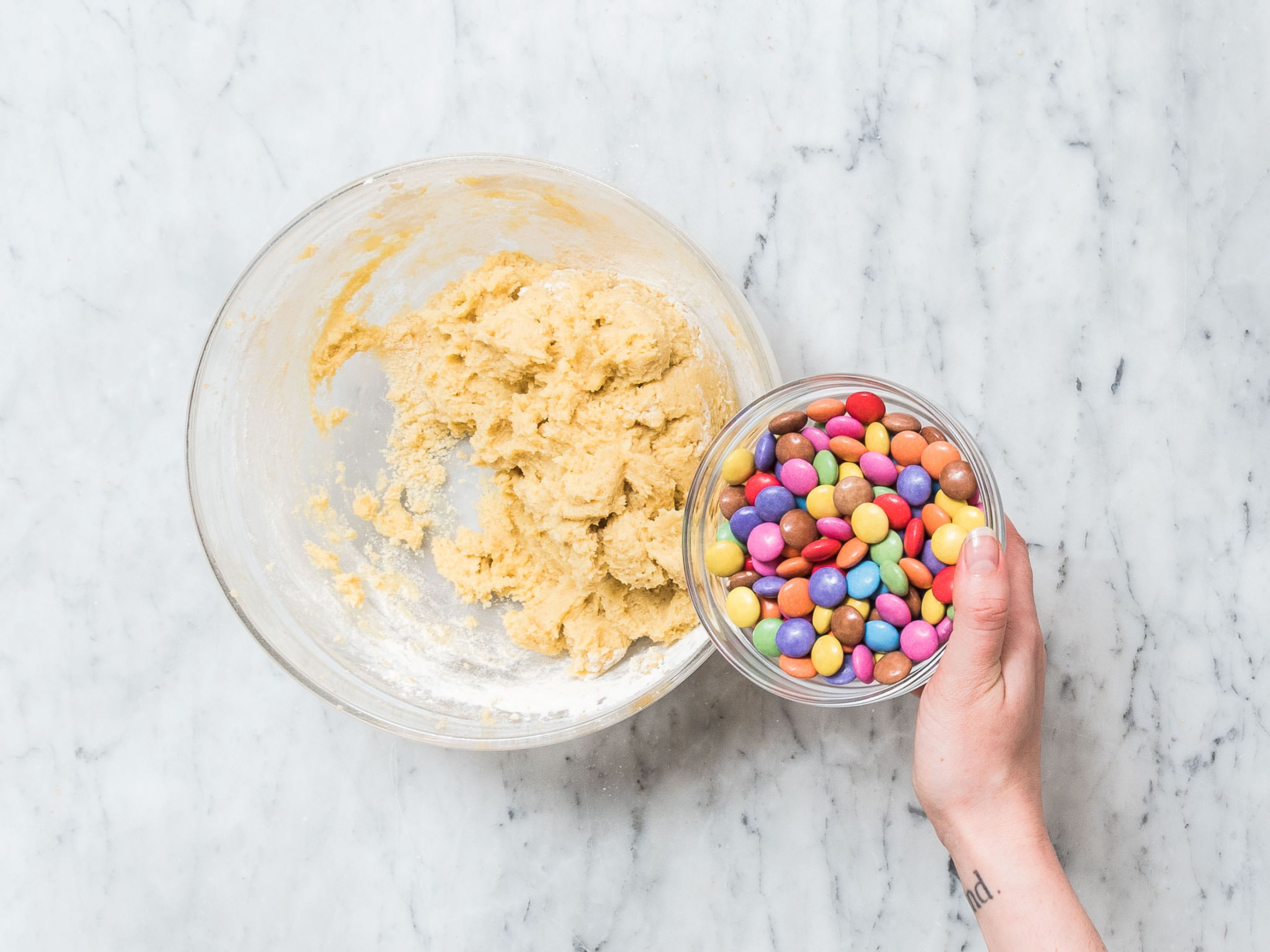 Stir flour mixture into butter-egg mixture and mix until well combined. Stir in some M&M’s and chocolate chips.