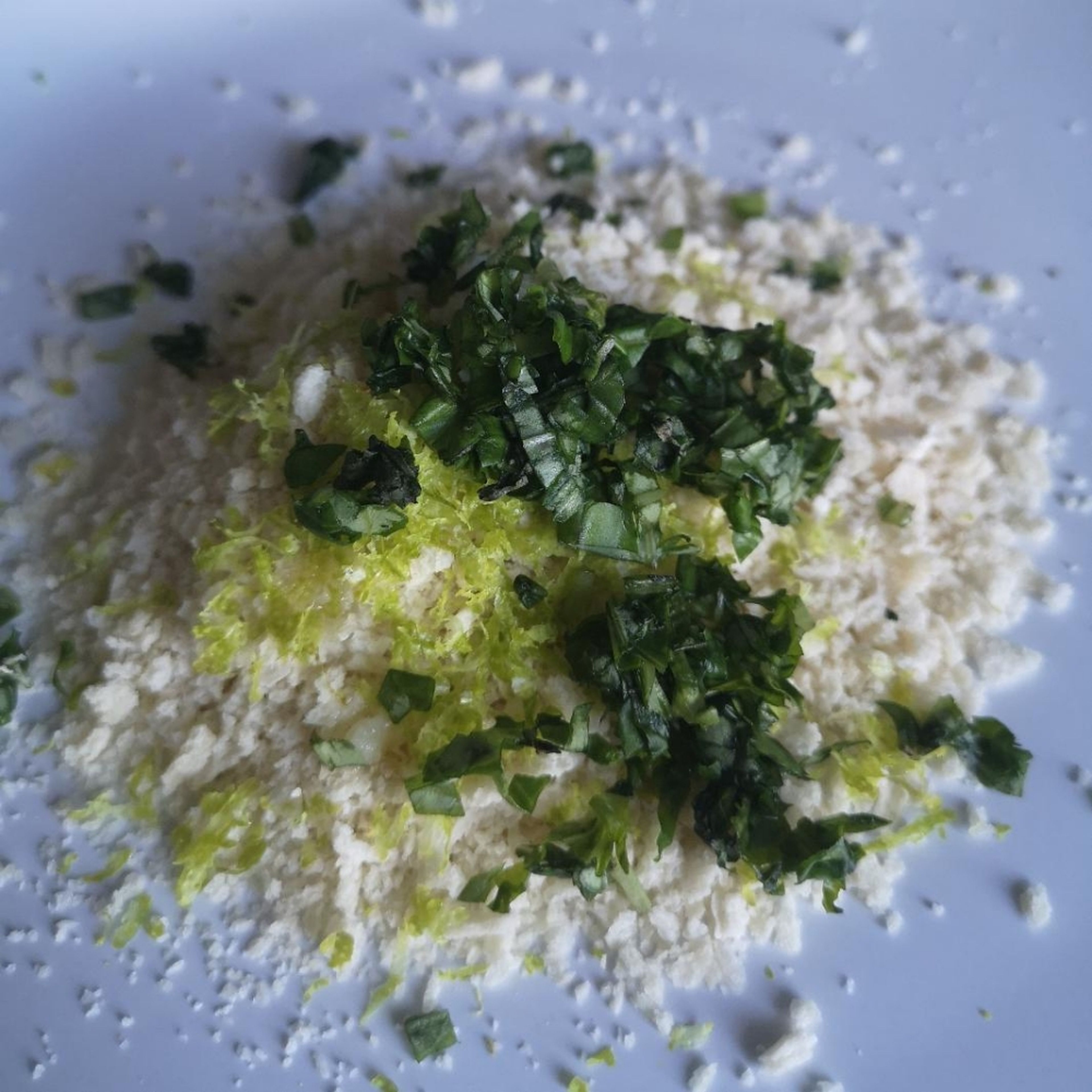 first, we make our crust. Mix together the panko breadcrumbs, lime zest, chopped parsley