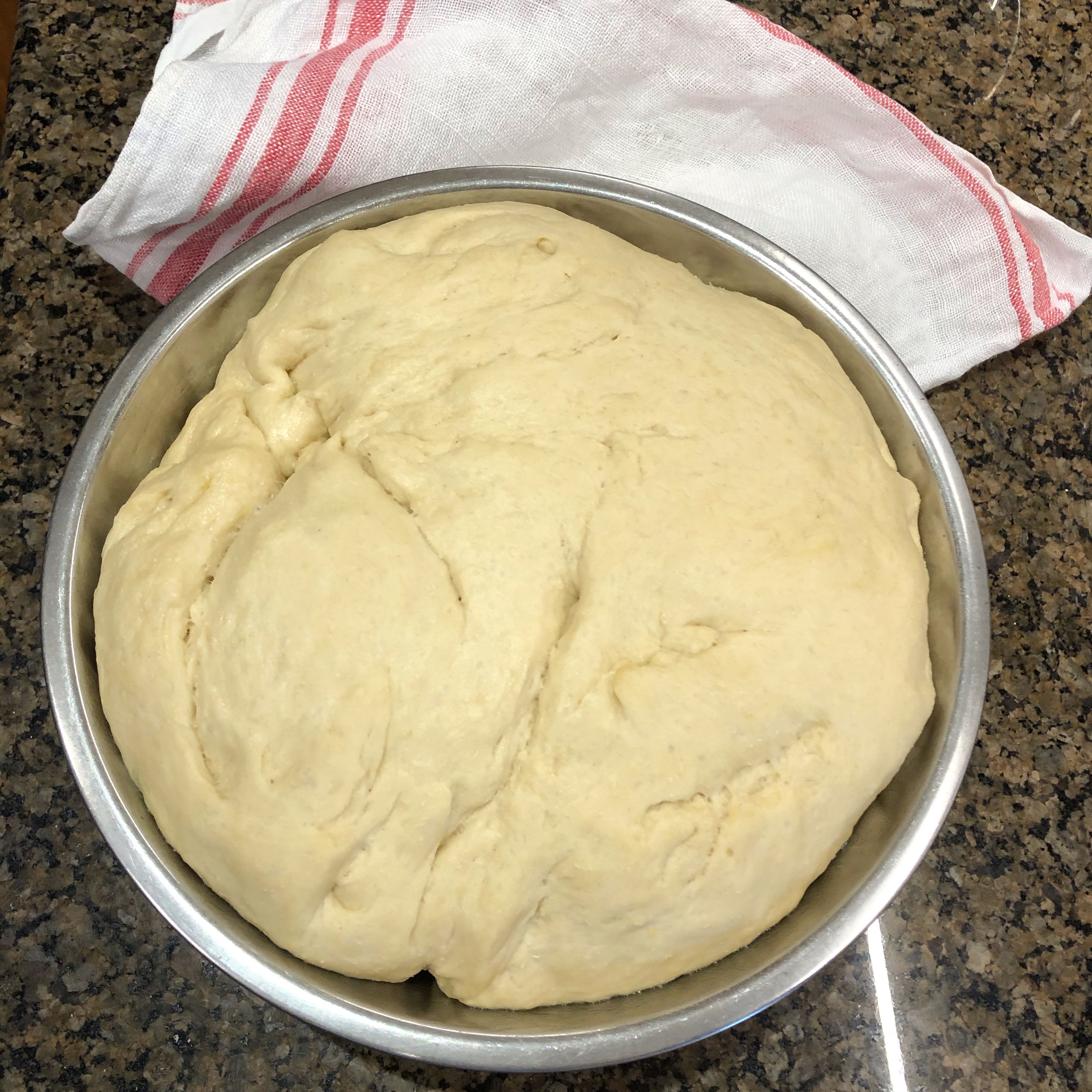 When dough is risen, punch down gently in bowl and then remove from bowl and place on clean counter.