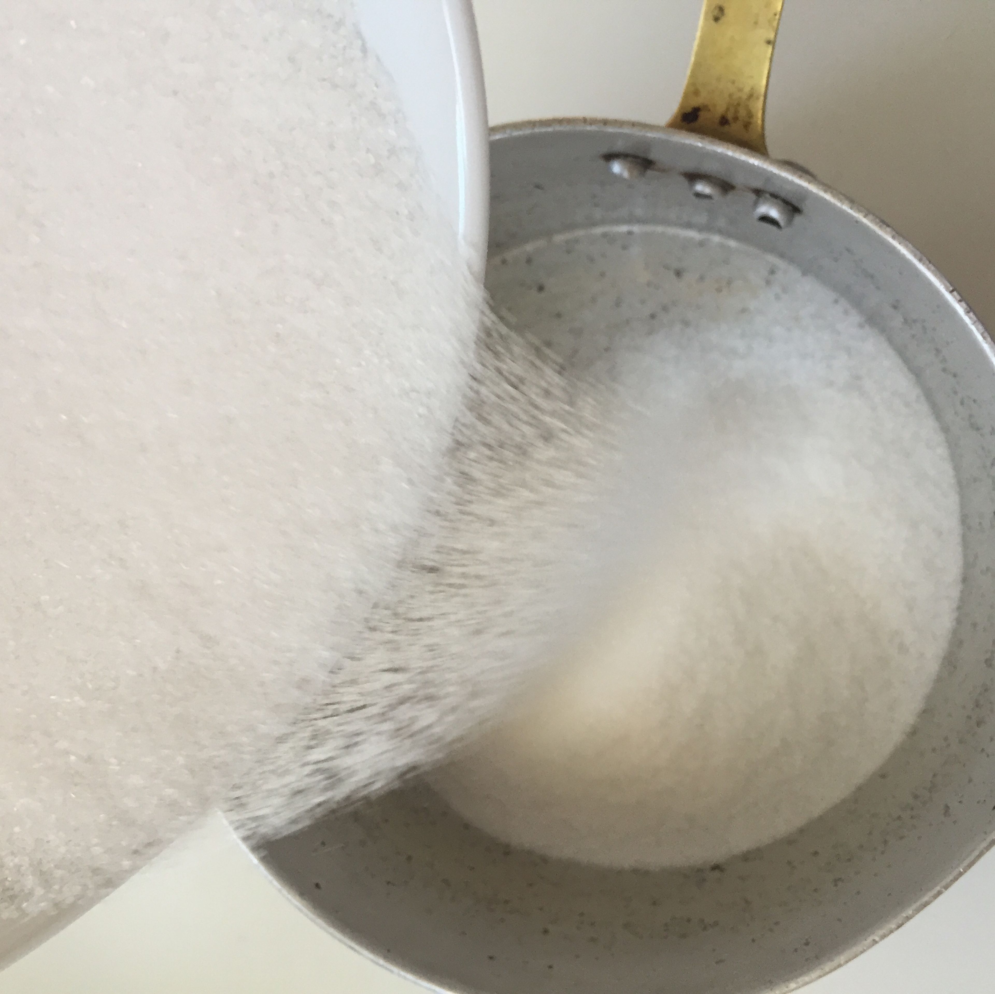 Pour sugar into a small saucepan, and heat over medium-high heat until it melts