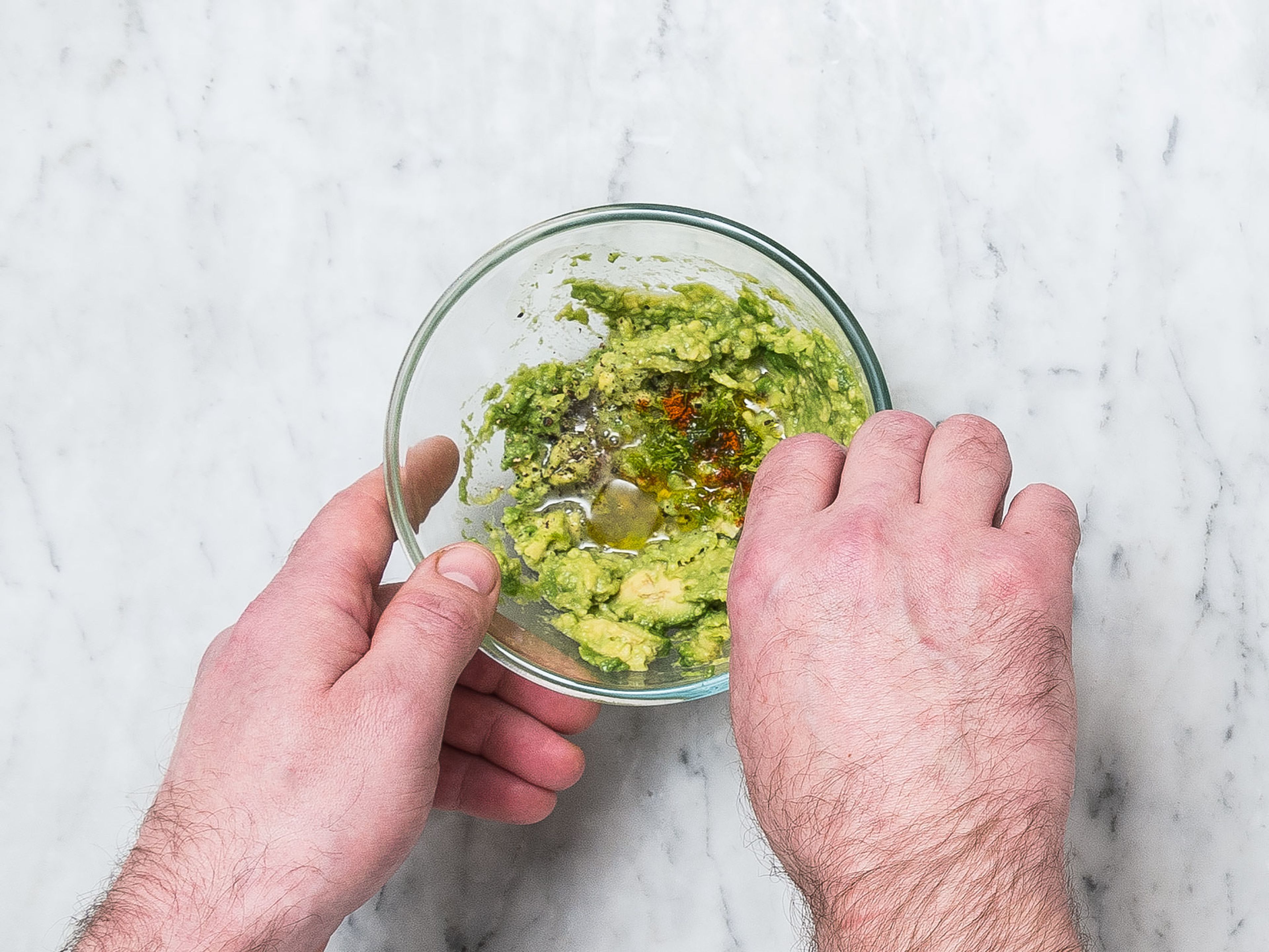 Halve and peel avocado, remove the pit, transfer to a small bowl, and mash with a fork. Season with remaining lime juice and zest, remaining cayenne pepper, salt, and olive oil to taste.