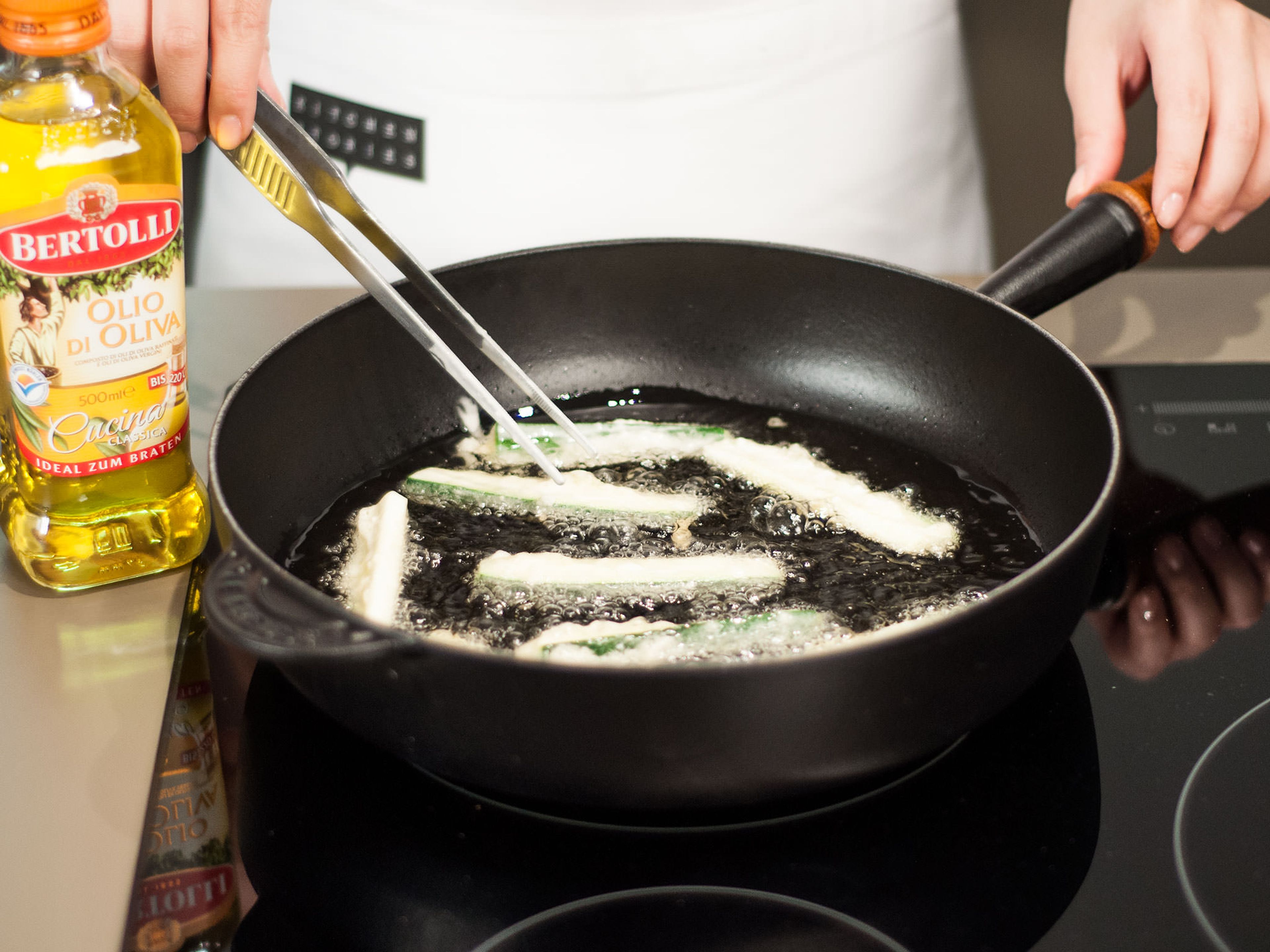 In a frying pan, heat up some vegetable oil over medium heat and cook zucchini for approx. 3 – 5 min. until golden brown. Transfer to a plate lined with paper towel and allow to cool for approx. 2 – 3 min. Then, transfer to a serving platter, drizzle with honey, and sprinkle with sea salt .Enjoy right away!