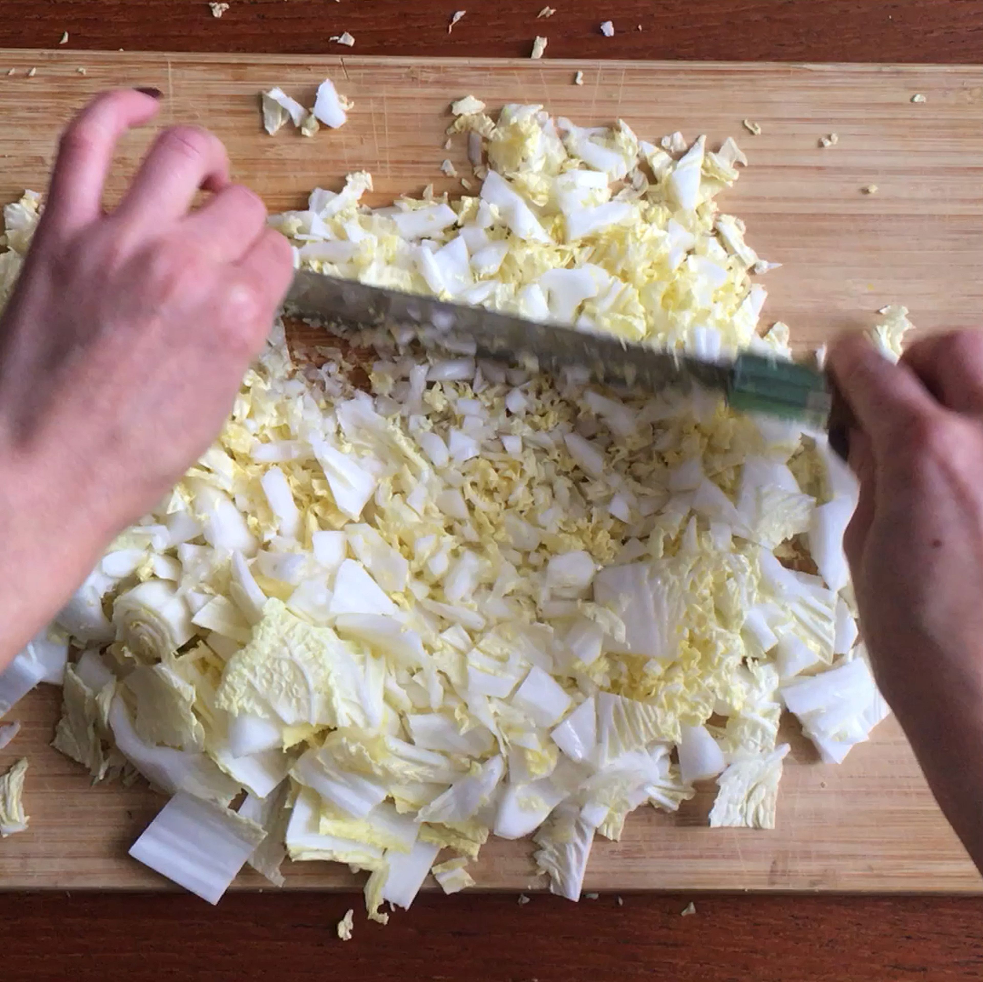 Finely cut both cabbages into small pieces and place in a large bowl.