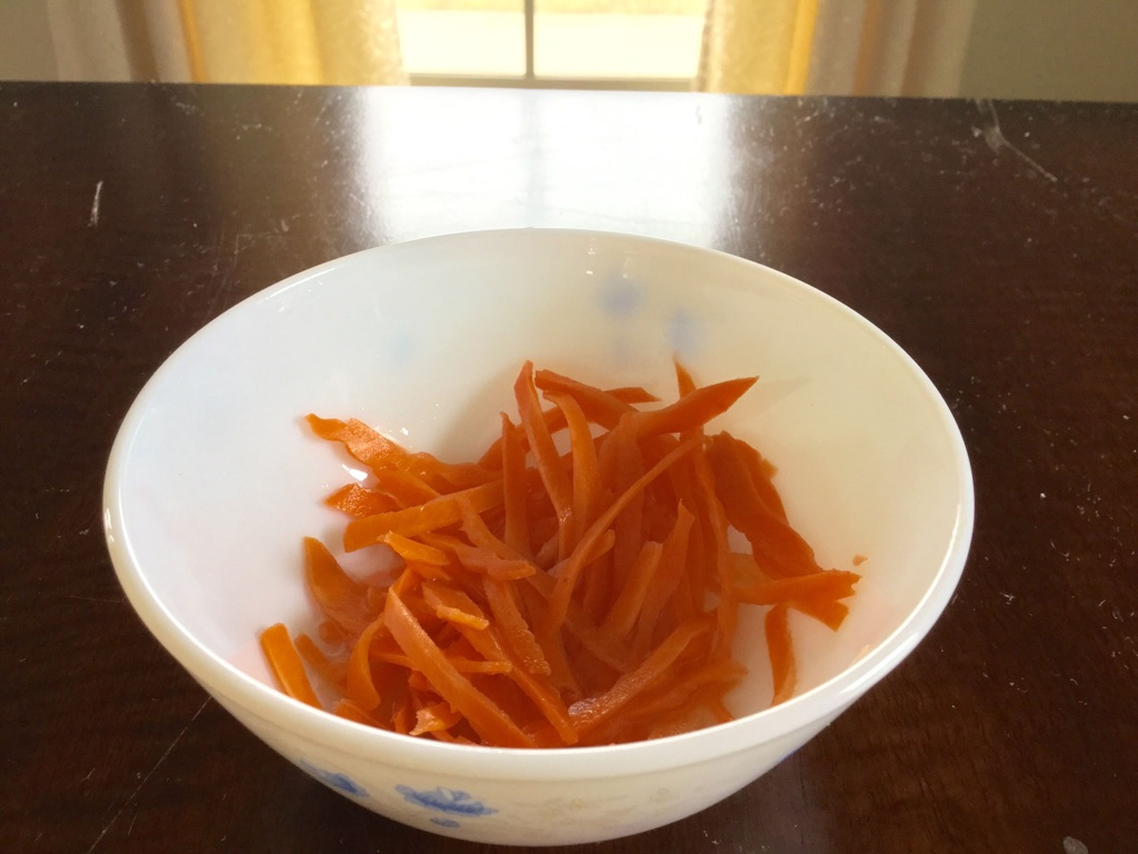 Julienne the carrot and add to a bowl. Add remaining sugar and lime juice. Toss to coat and set aside.