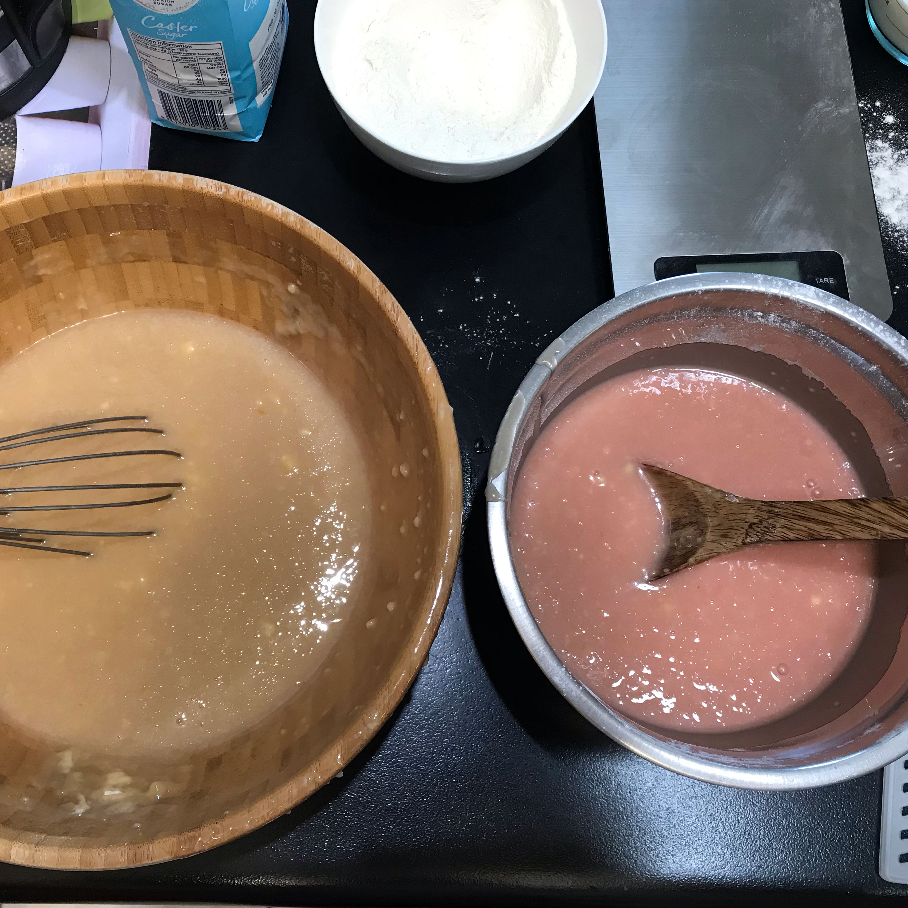 Divide the cake batter evenly between two bowls. Tint one bowl with pink food coloring and mix until colored.
