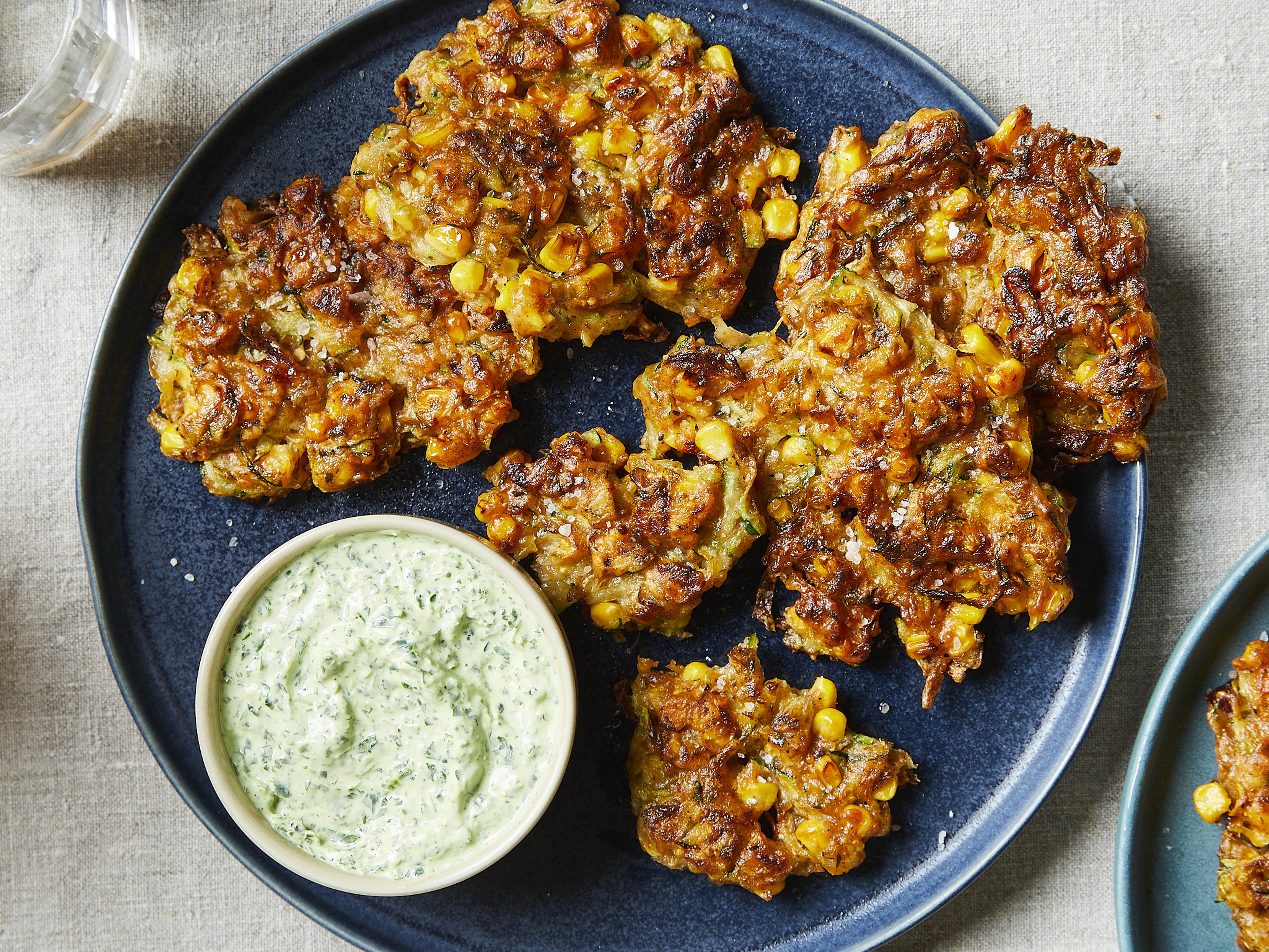 Crispy corn zucchini fritters with herb dip