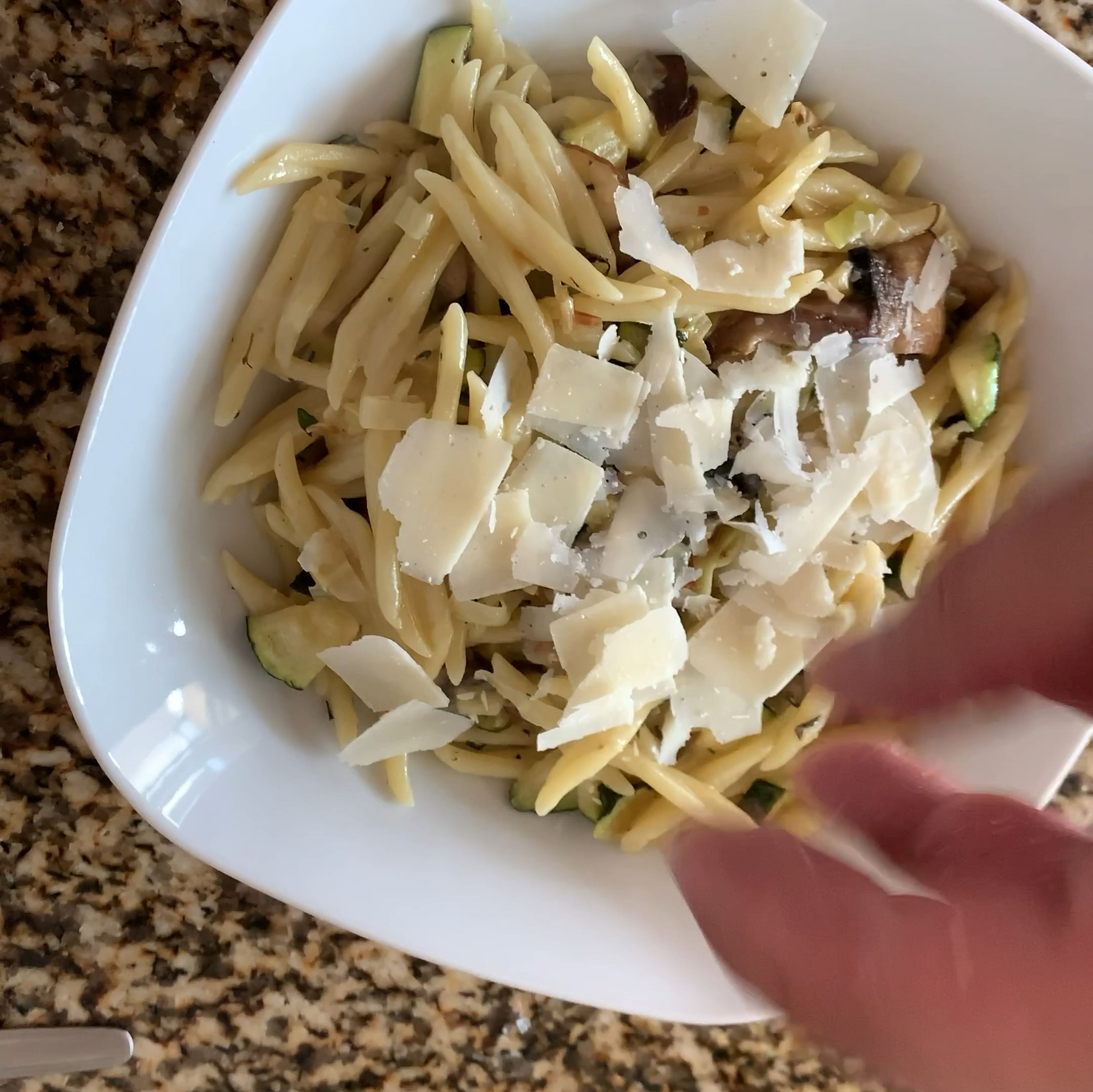 I got those slides of grana padano using a peeler. Then added to the top of pasta.