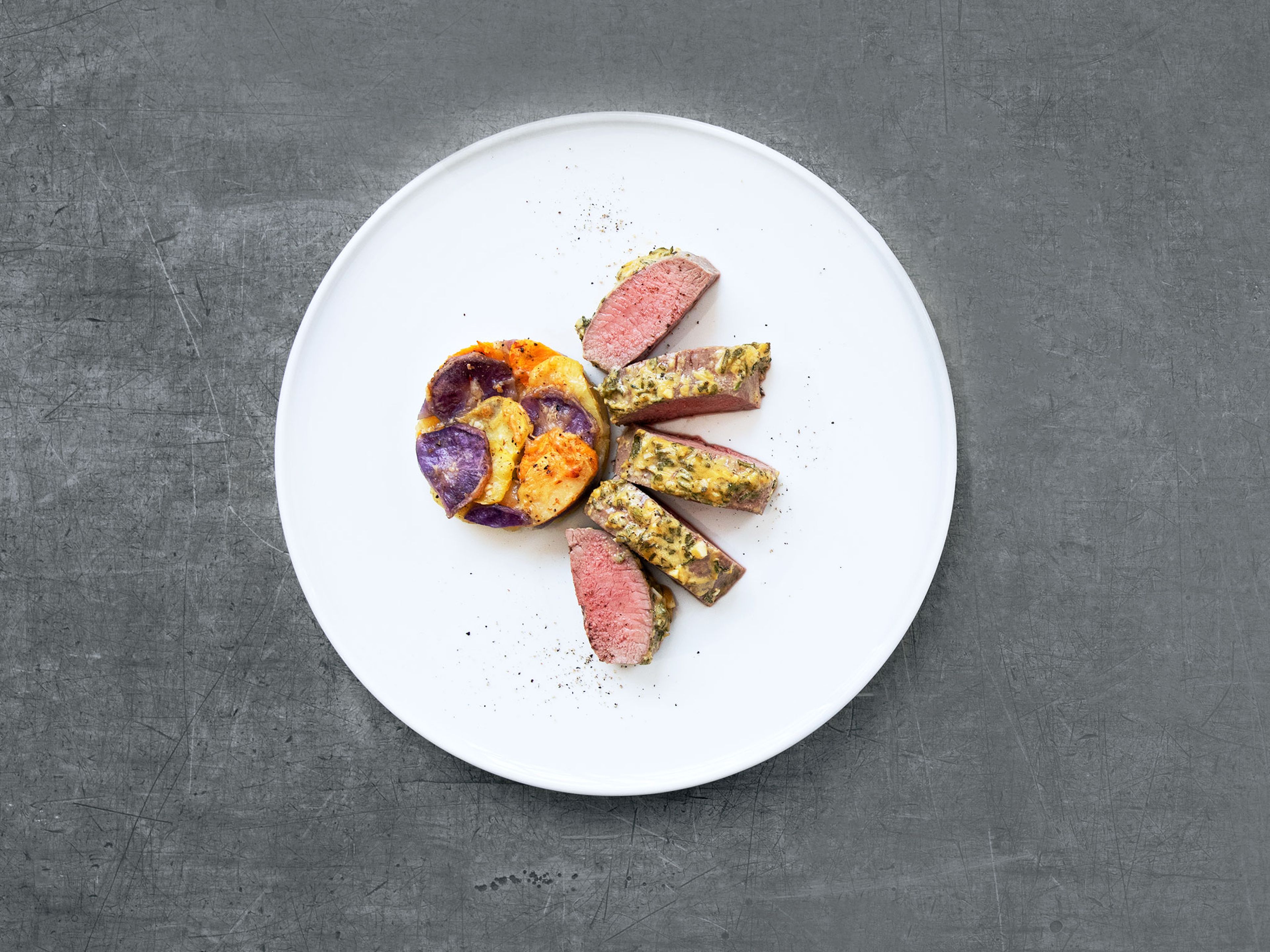 Oven-baked saddle of lamb with mustard-herb crust